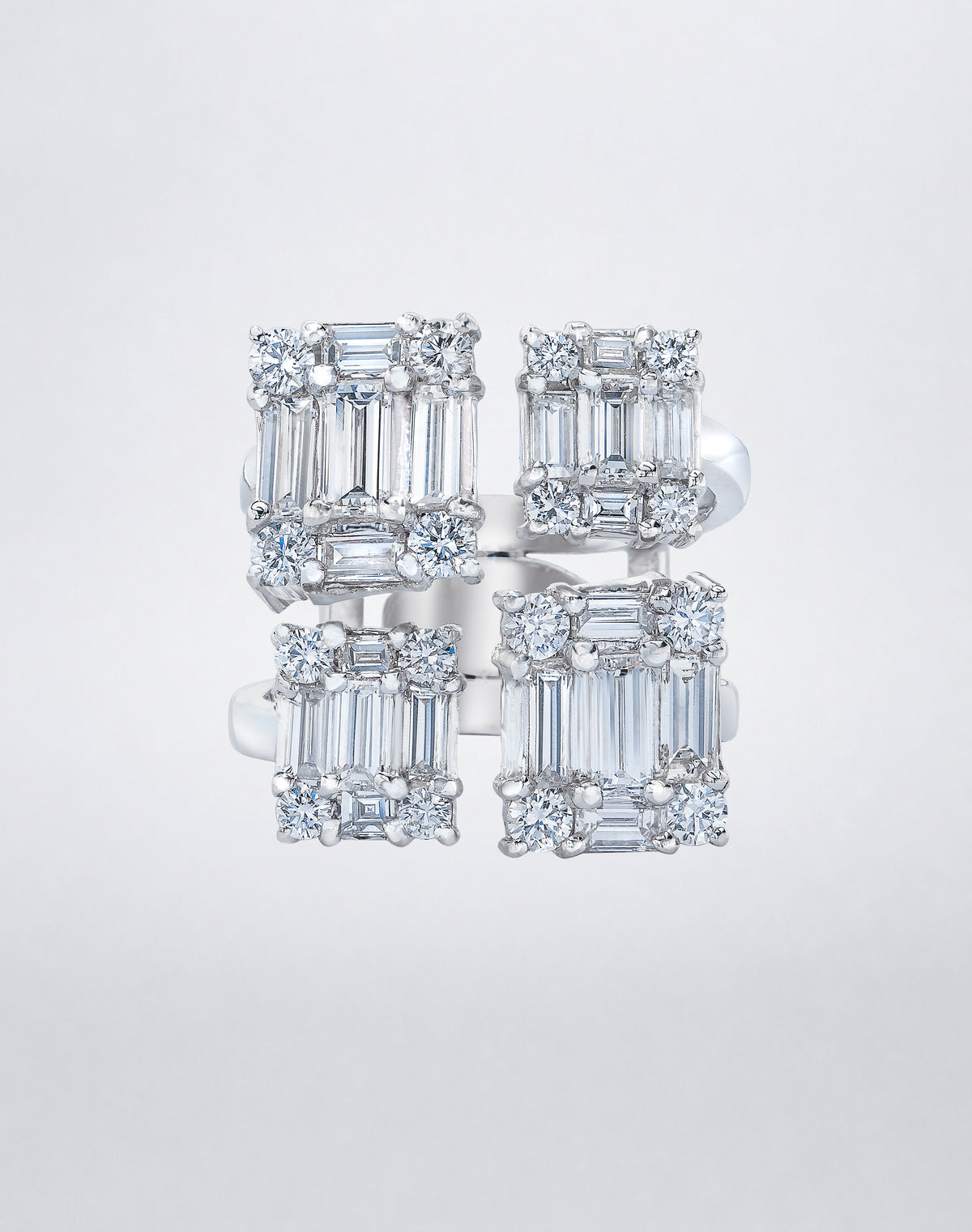 CLARITY³ Quad Ring in 18K white gold featuring four rectangular clusters of baguette-cut and round diamonds, front view