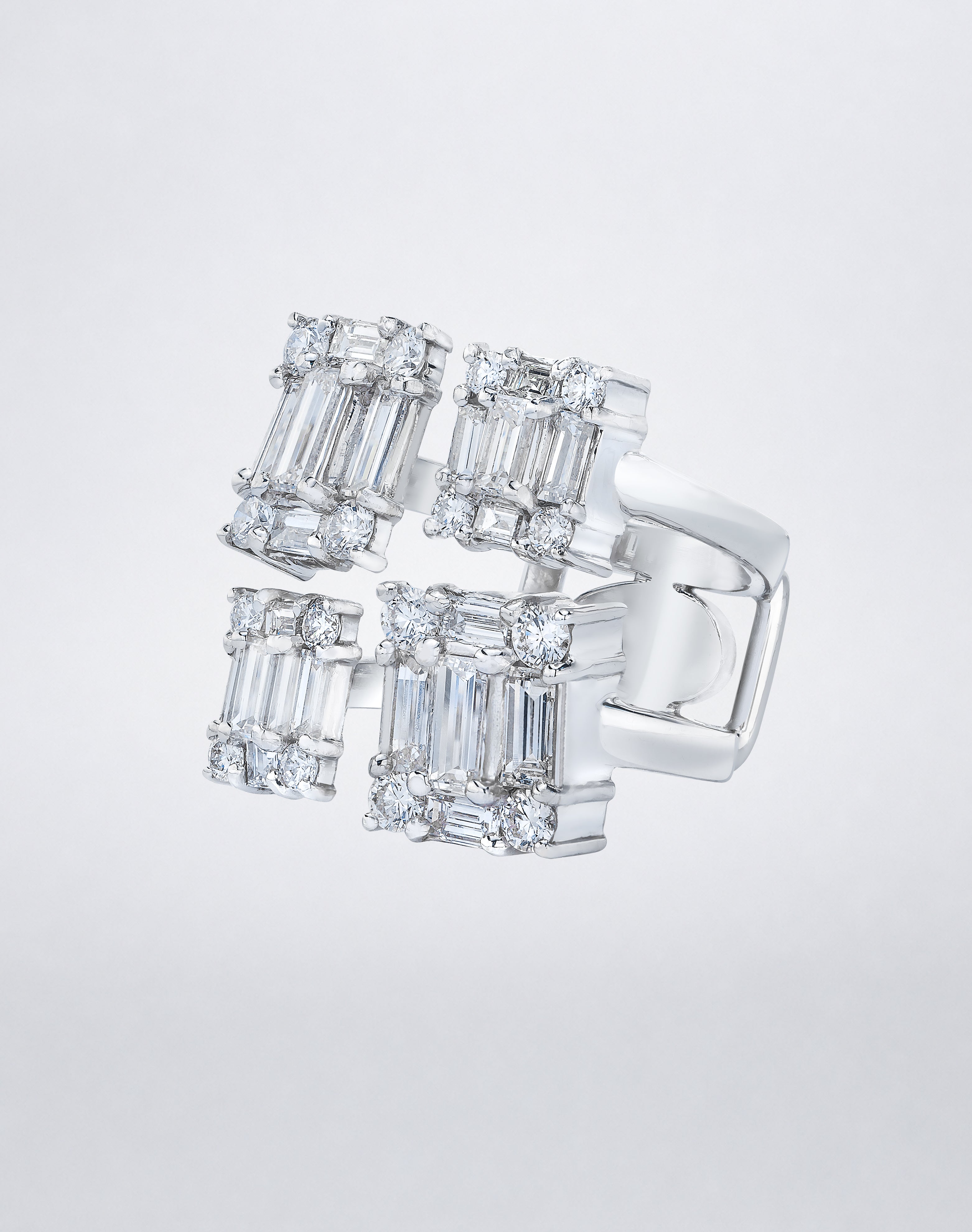 CLARITY³ Quad Ring in 18K white gold featuring four rectangular clusters of baguette-cut and round diamonds, side view
