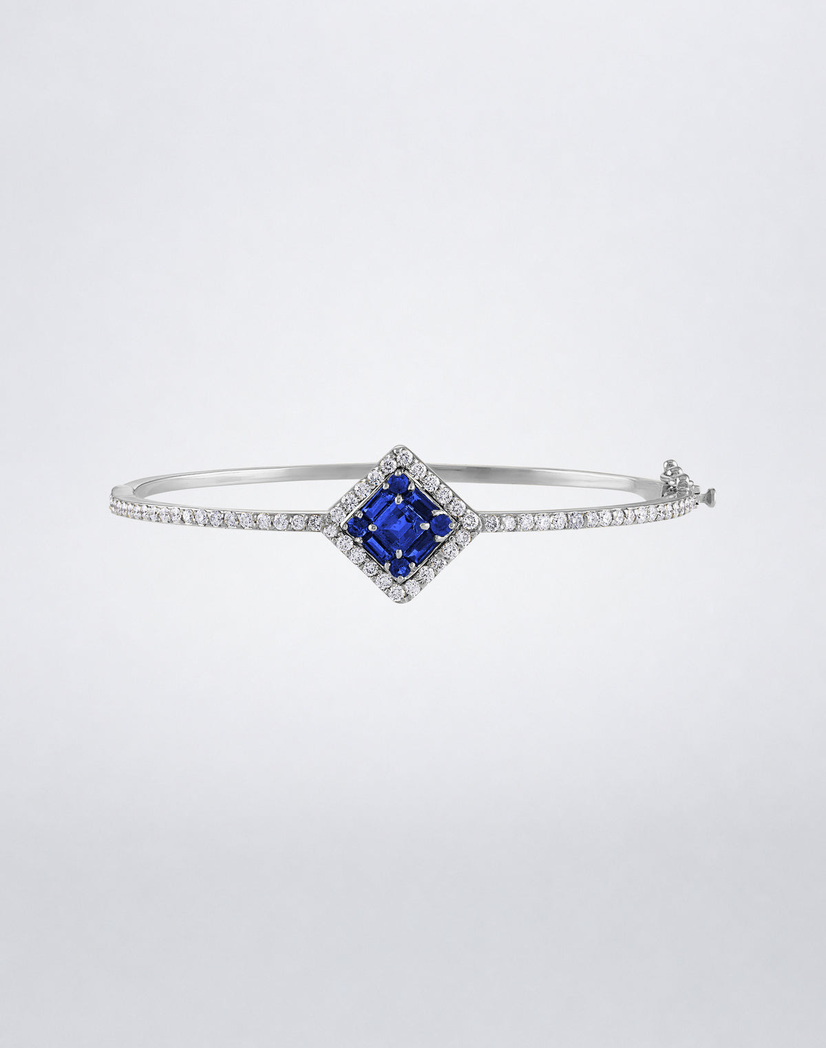 Mindi Mond New York Clarity³ Gemstone Halo Bracelet in 18k white gold with a nine-stone baguette and round sapphire center, diamond halo and pavé band, front view