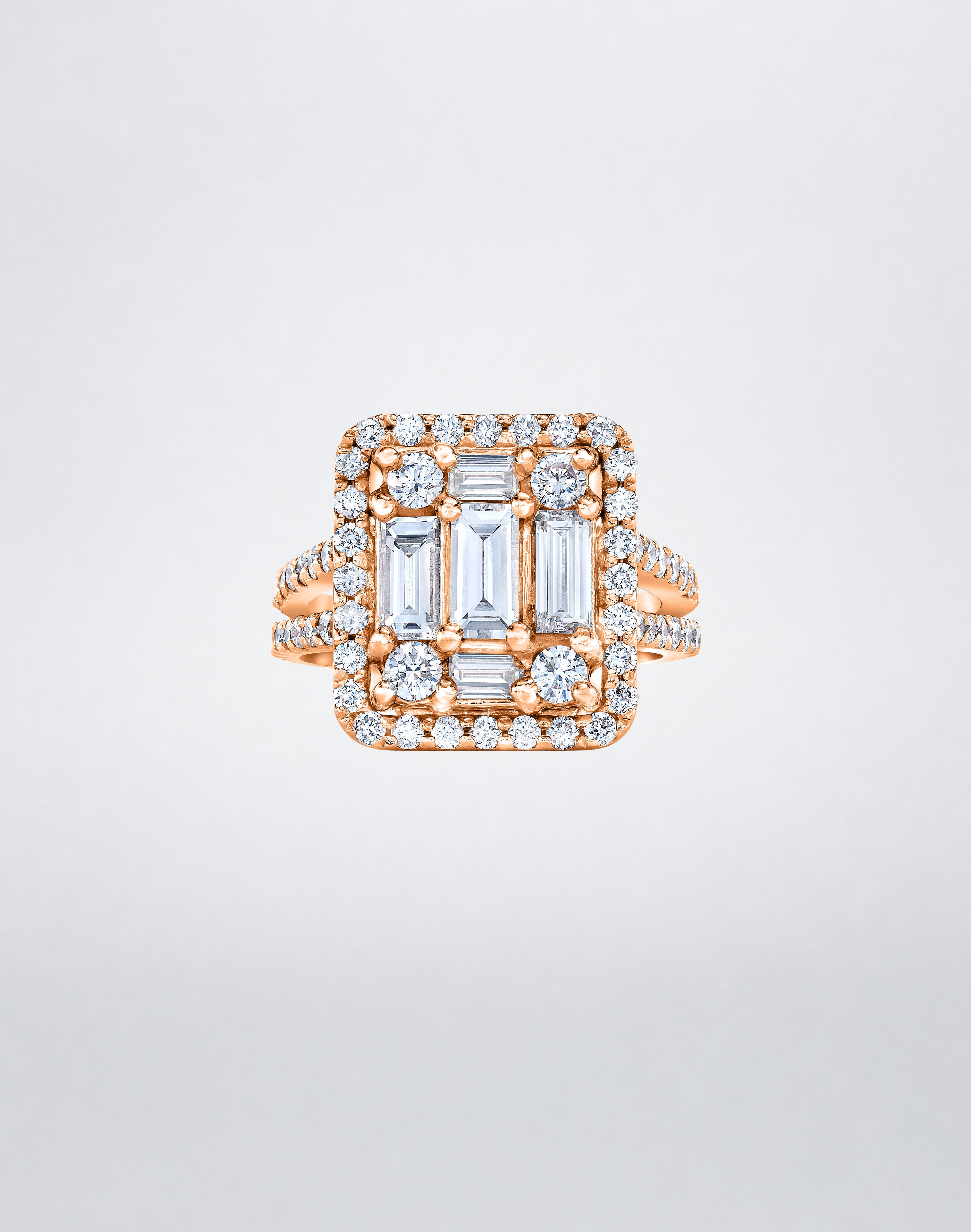 CLARITY³ Split-Shank Halo Ring in 18K rose gold with a baguette diamond cluster and round diamond halo, by Mindi Mond New York