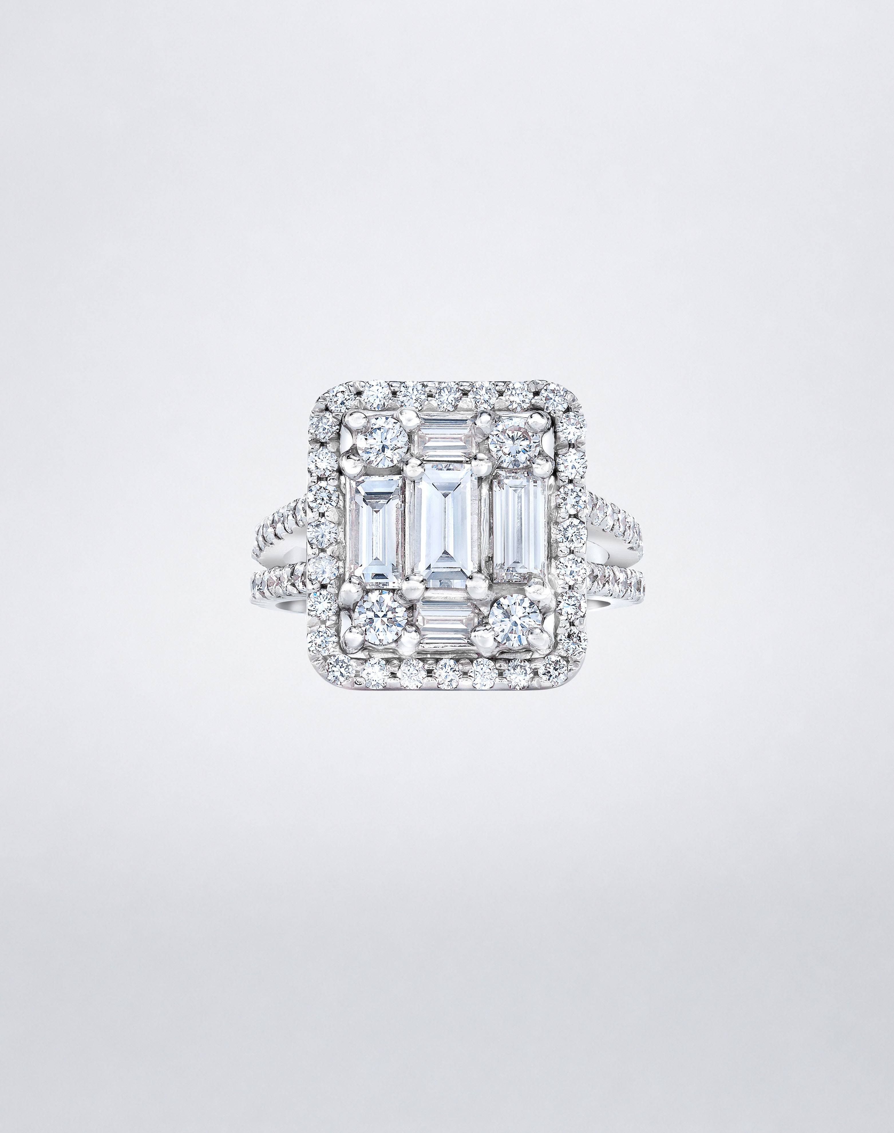 CLARITY³ Split-Shank Halo Ring in 18K white gold with a baguette diamond cluster and round diamond halo, by Mindi Mond New York