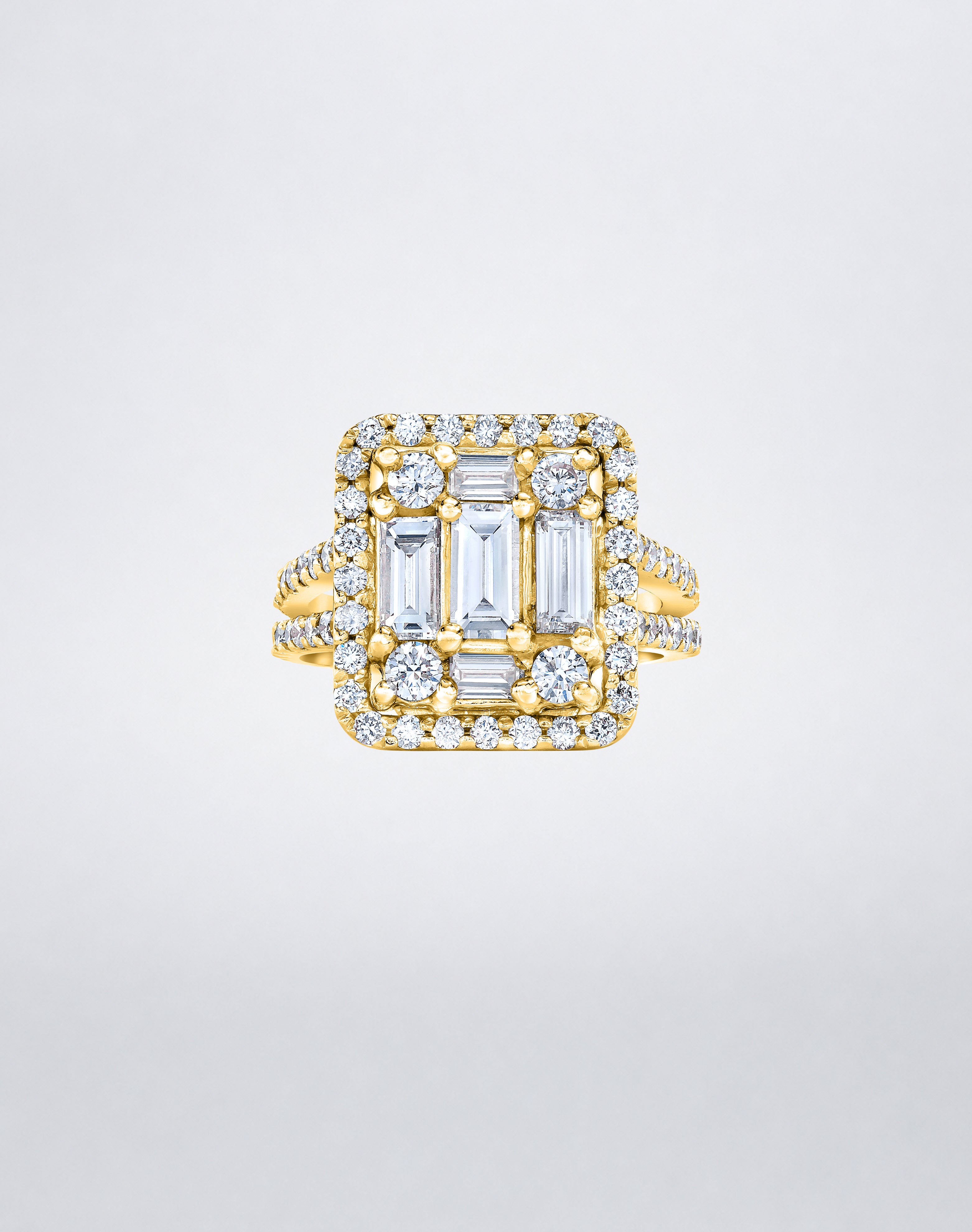 CLARITY³ Split-Shank Halo Ring in 18K yellow gold with a baguette diamond cluster and round diamond halo, by Mindi Mond New York