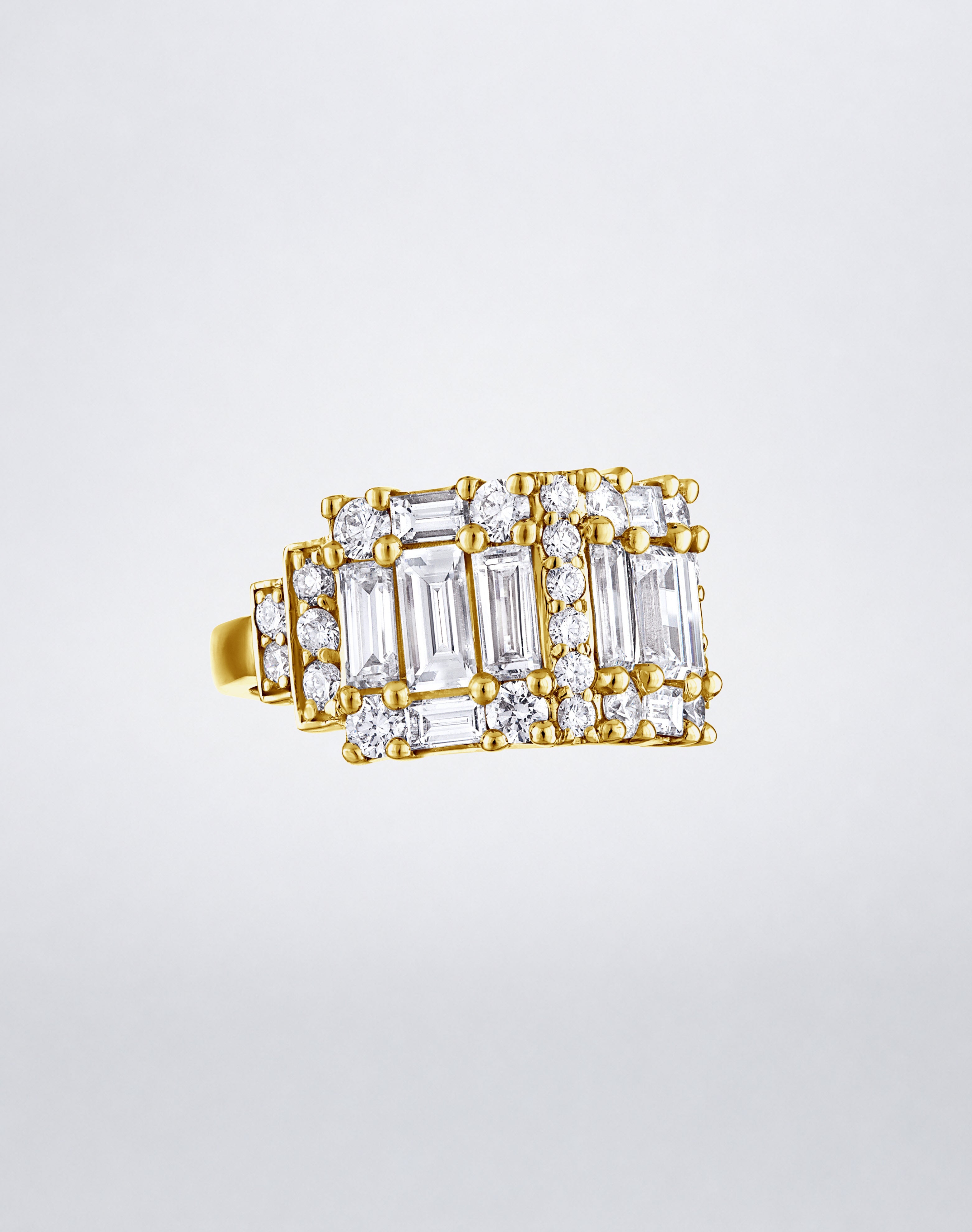 CLARITY³ Step Diamond Band in 18K yellow gold, featuring alternating columns of baguette and round diamonds, shown at an angle, by Mindi Mond New York