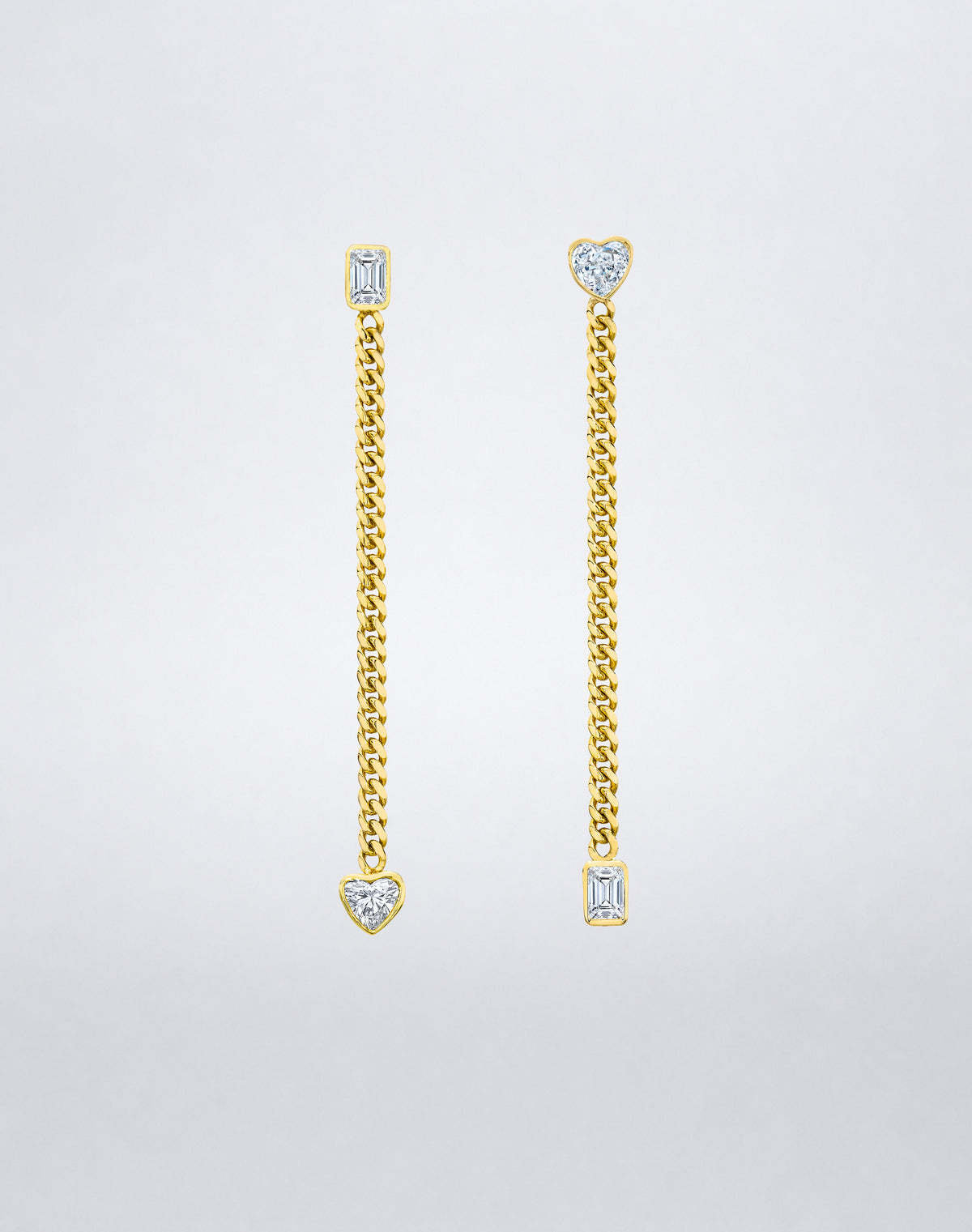 Mindi Mond New York Fancy Cut Chain Mismatched Earrings in 18K yellow gold, bezel-set emerald and heart-cut diamonds swapped top to bottom on fine curb chains