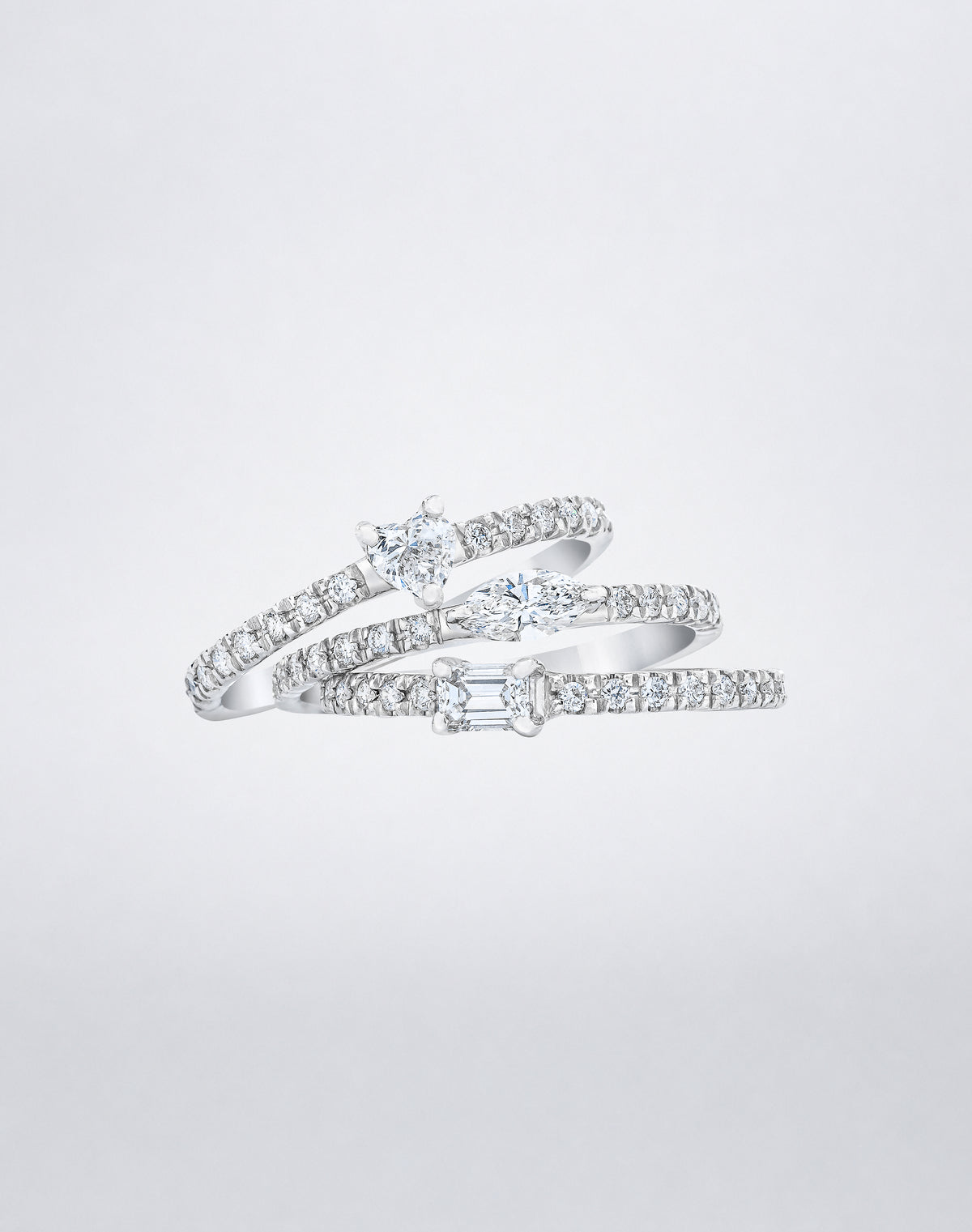 Mindi Mond New York Fancy Cut Diamond Stackable Rings in 18K white gold, three slim pavé bands with heart, marquise and emerald-cut diamonds stacked together