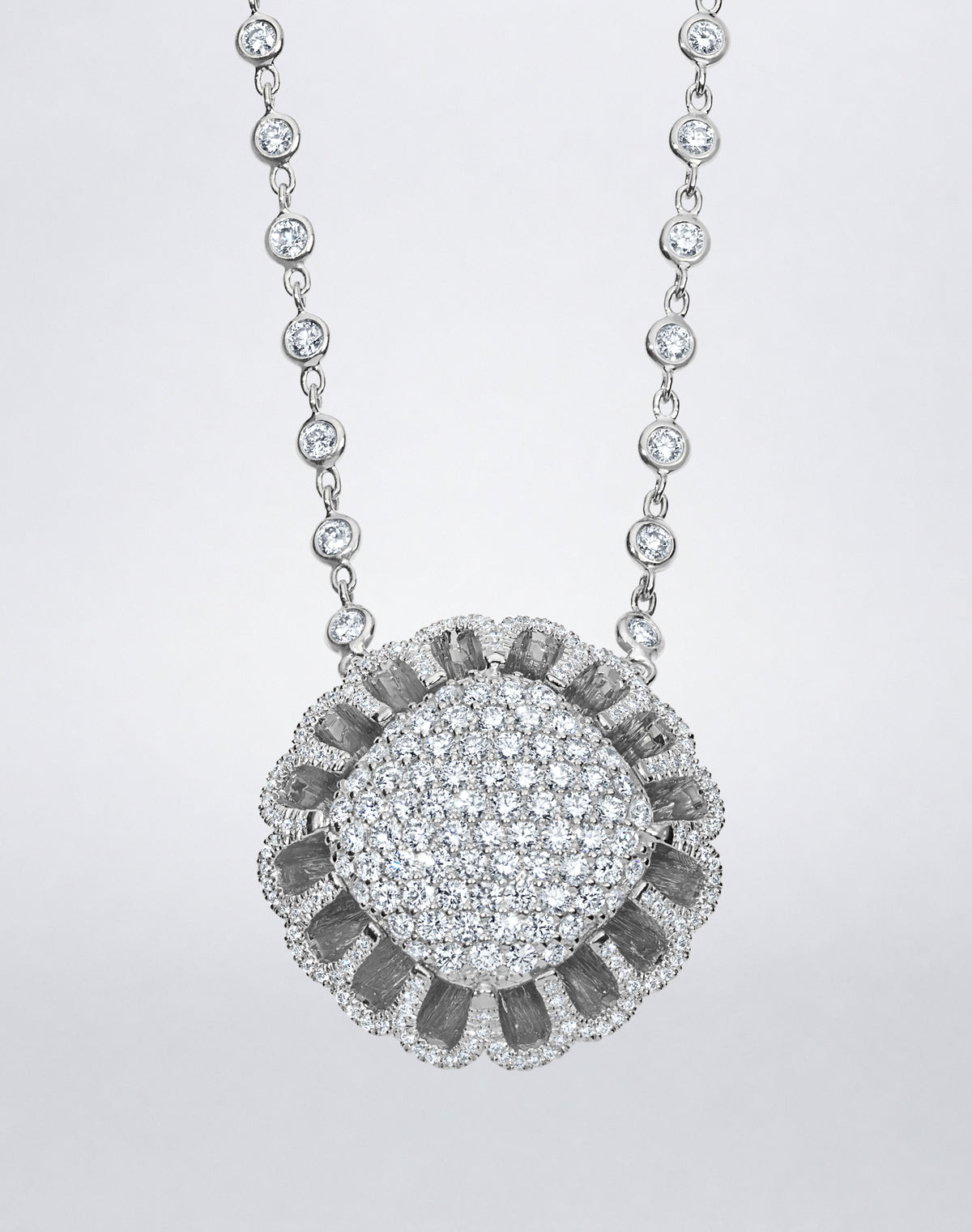 Detail of Mindi Mond New York Floating Hues All Diamond Necklace with pavé diamond medallion in signature elliptical setting in 18K white gold