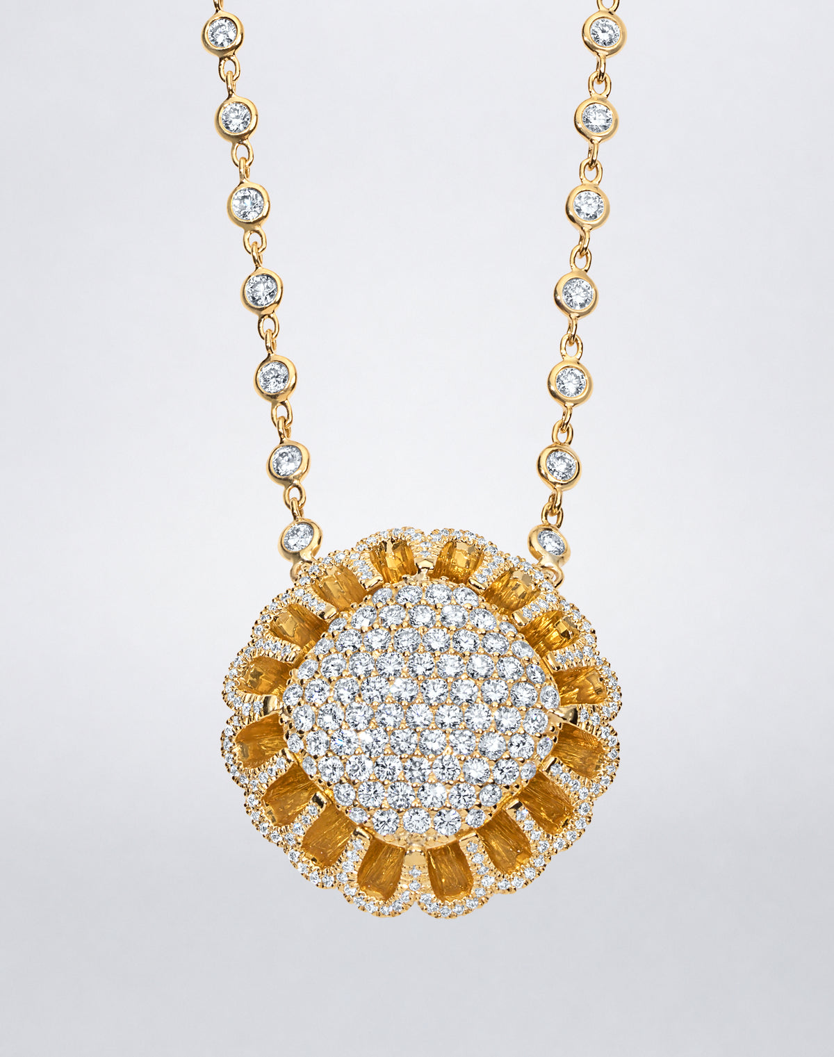 Detail of Mindi Mond New York Floating Hues All Diamond Necklace with pavé diamond medallion in signature elliptical setting in 18K yellow gold