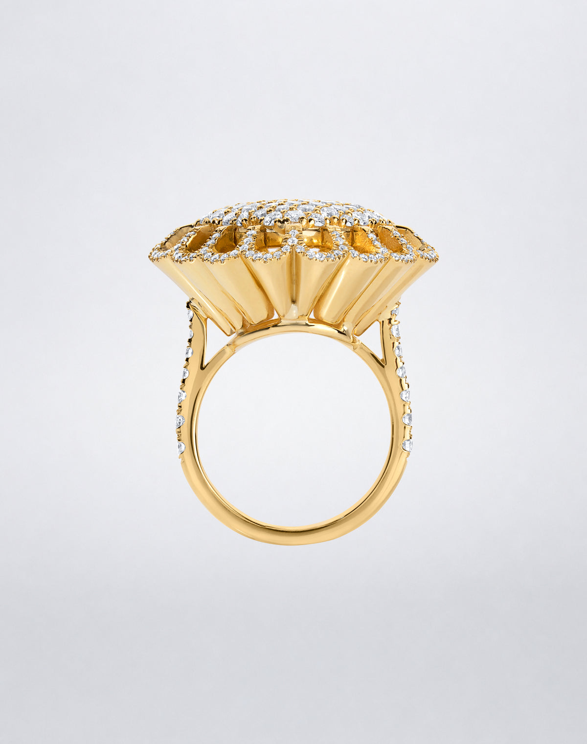 Side view of the Mindi Mond New York FLOATING HUES All Diamond Ring in 18K yellow gold, highlighting the sculptural iconic elliptical setting.
