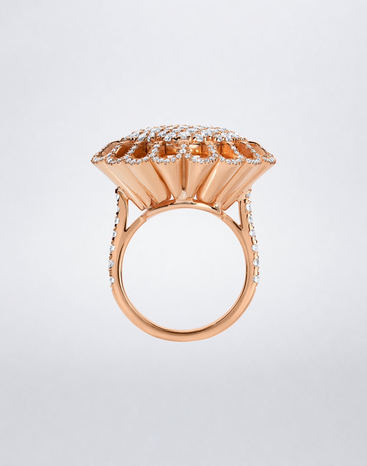 Side view of the Mindi Mond New York FLOATING HUES All Diamond Ring in 18K rose gold, highlighting the sculptural iconic elliptical setting.