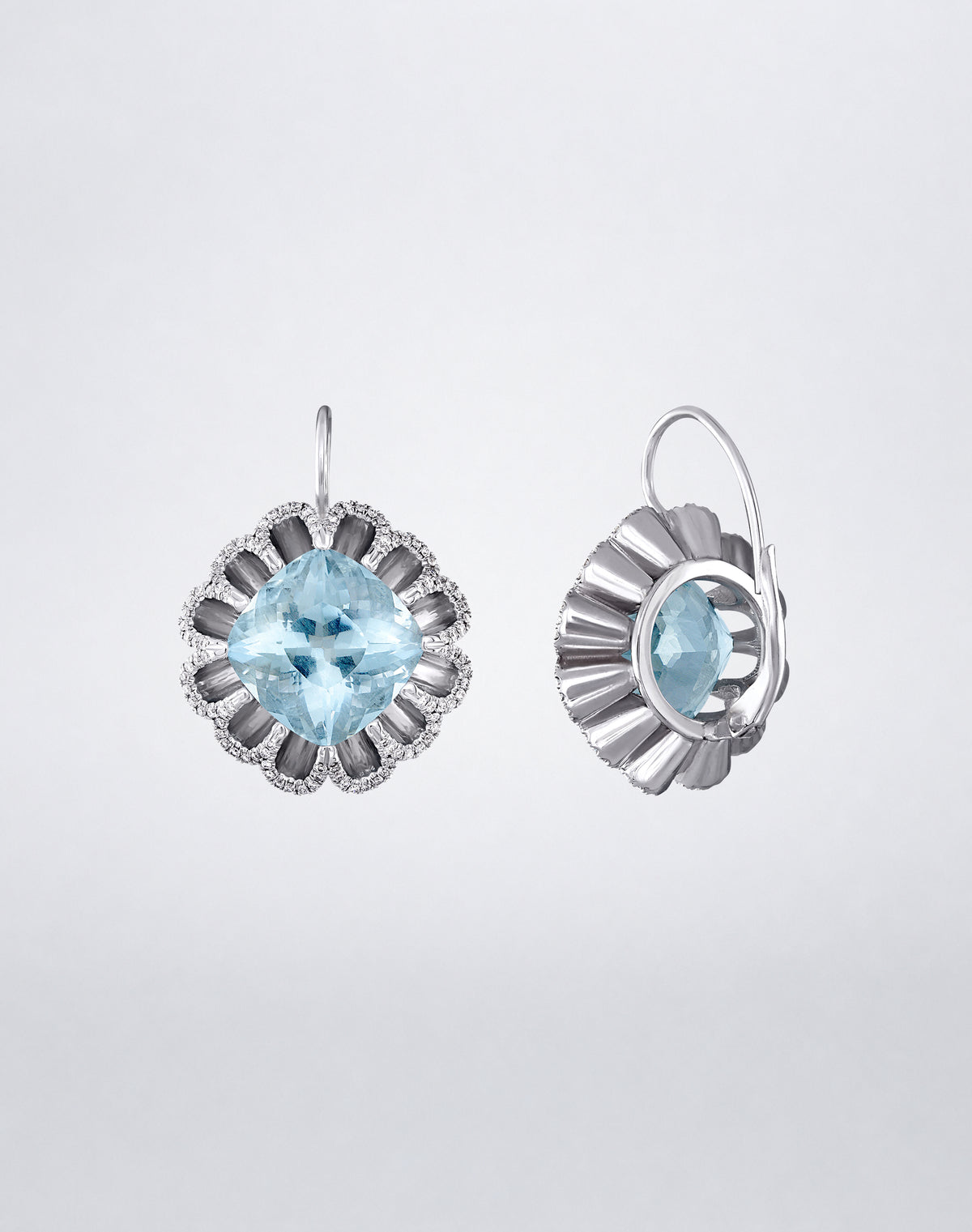 Side detail of Mindi Mond New York Floating Hues Aquamarine and Diamond Drop Earrings with cushion-cut aquamarines and leverback closures in 18K white gold
