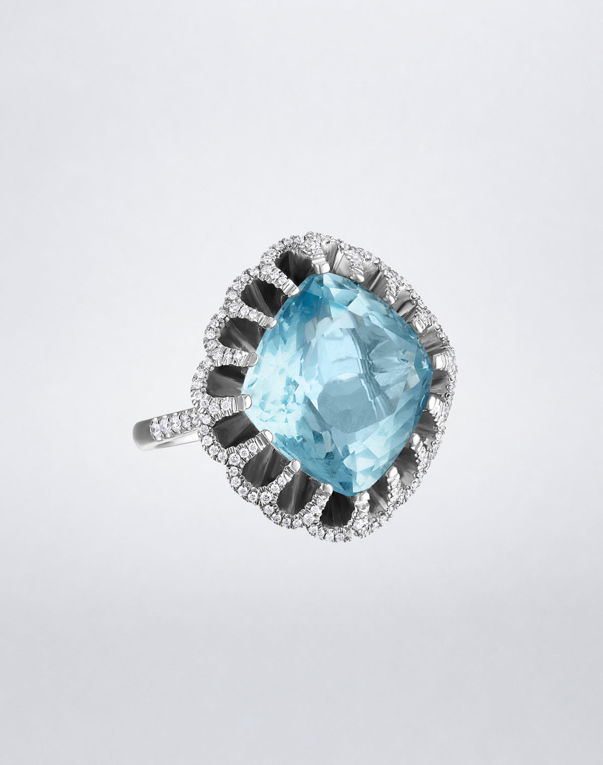Mindi Mond New York FLOATING HUES Aquamarine and Diamond Ring in 18K white gold, angled view featuring a cushion-cut aquamarine in the iconic elliptical setting.