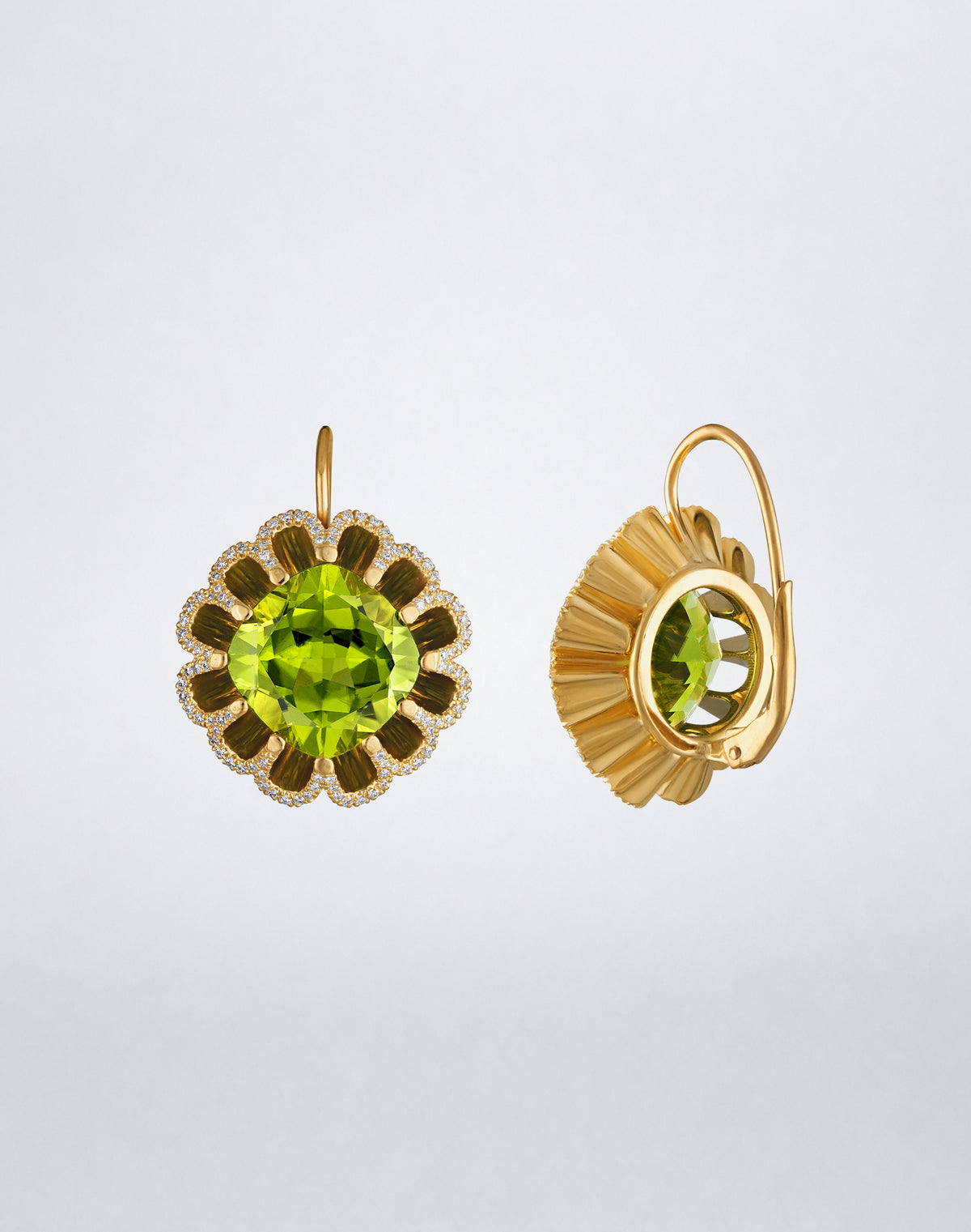 Side detail of Mindi Mond New York Floating Hues Peridot and Diamond Drop Earrings with cushion-cut peridots and leverback closures in 18K yellow gold