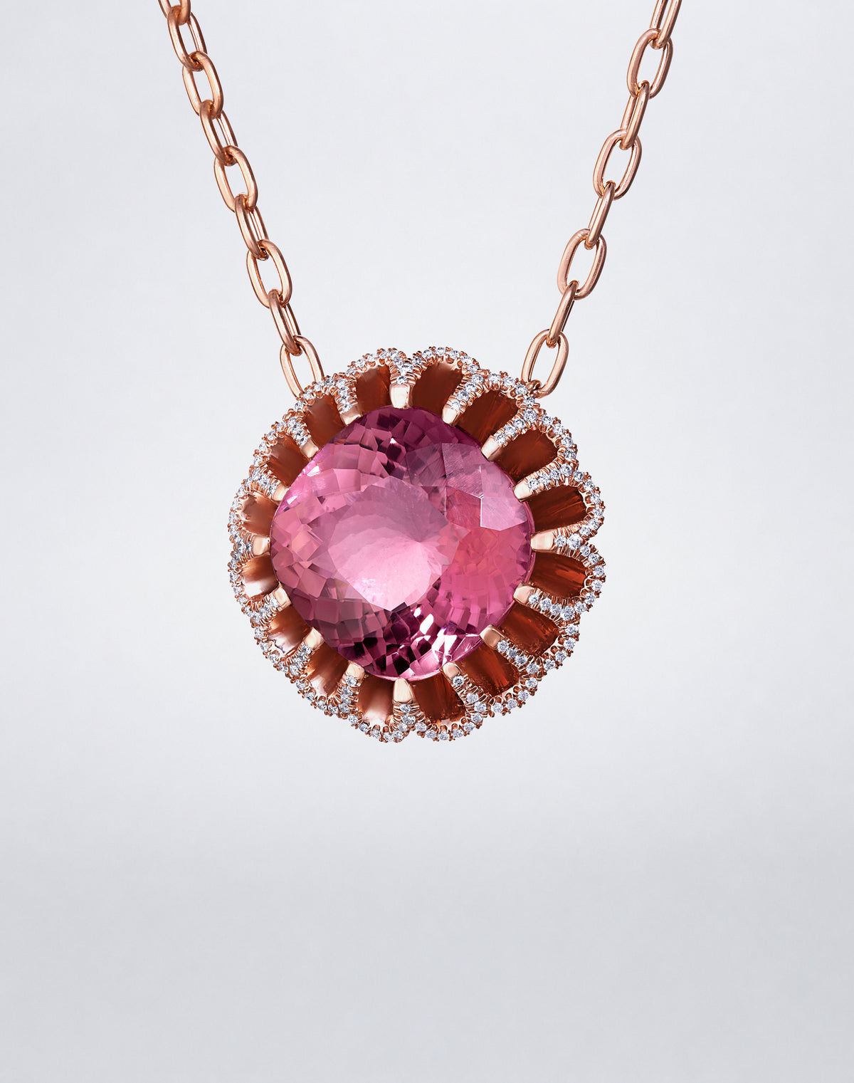 Side view of Mindi Mond New York Floating Hues Pink Tourmaline and Diamond Necklace showing the dimensional elliptical setting in 18K rose gold