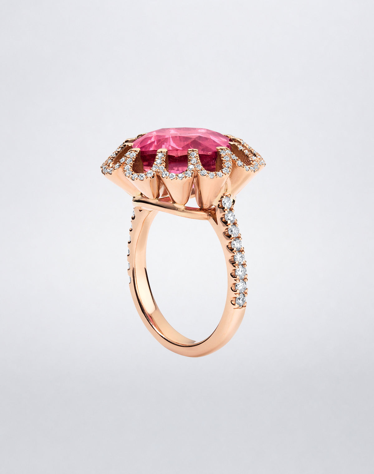 Side view of the Mindi Mond New York FLOATING HUES Mini Pink Tourmaline and Diamond Ring in 18K rose gold, highlighting the cushion-cut tourmaline and iconic elliptical setting.