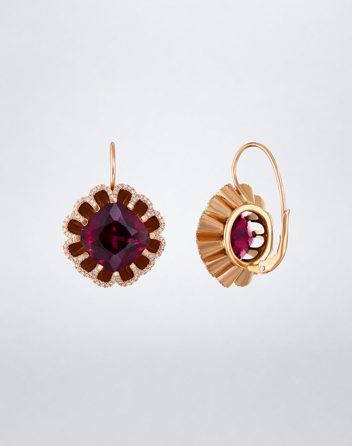 Side detail of Mindi Mond New York Floating Hues Rhodolite Garnet and Diamond Drop Earrings with cushion-cut garnets and leverback closures in 18K rose gold