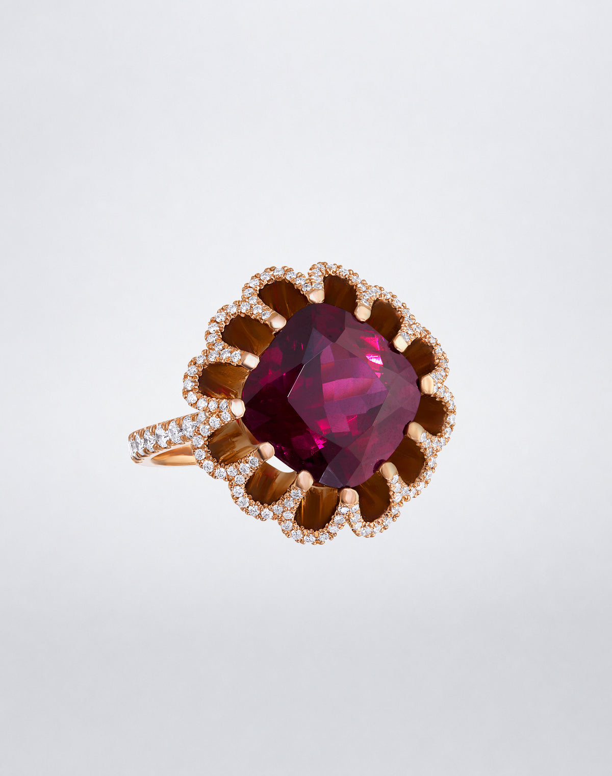 Mindi Mond New York FLOATING HUES Rhodolite Garnet and Diamond Petite Ring in 18K rose gold, front view featuring an oval-cut garnet in the iconic elliptical setting.