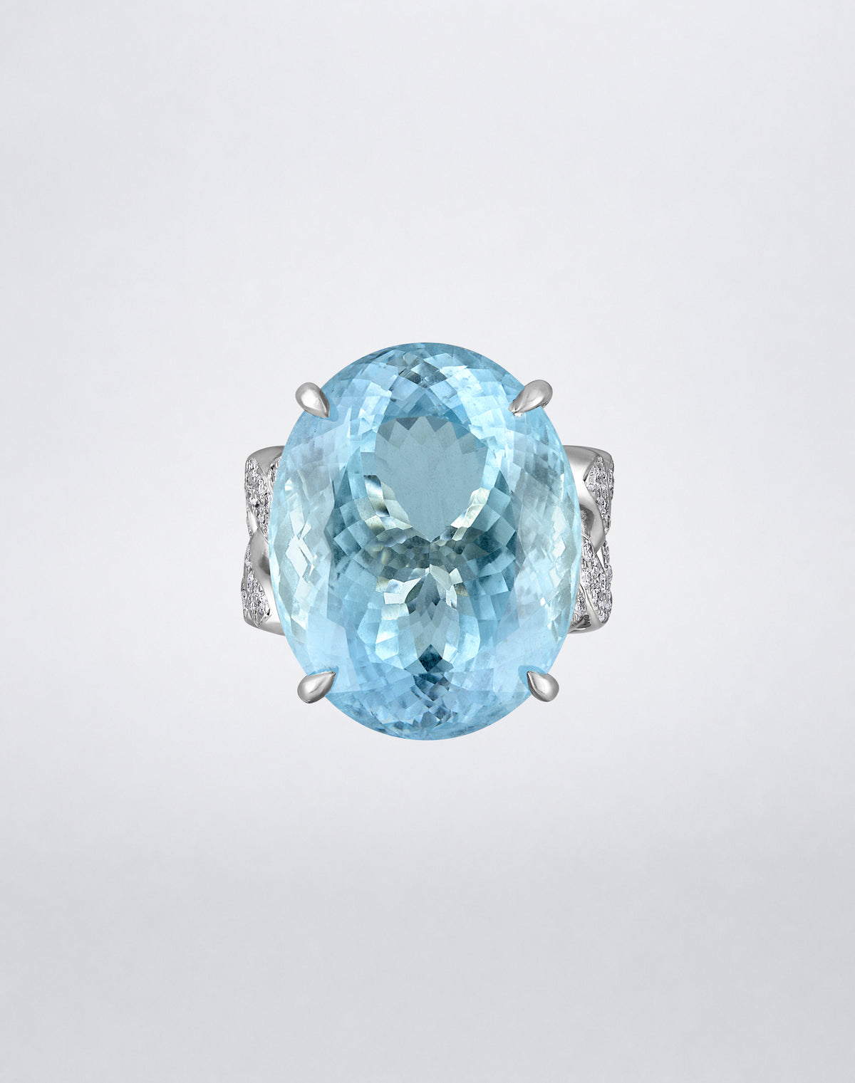 Front view of the Mindi Mond New York Aquamarine and Diamond Link Ring featuring an oval aquamarine in 18K white gold with diamond link detailing.