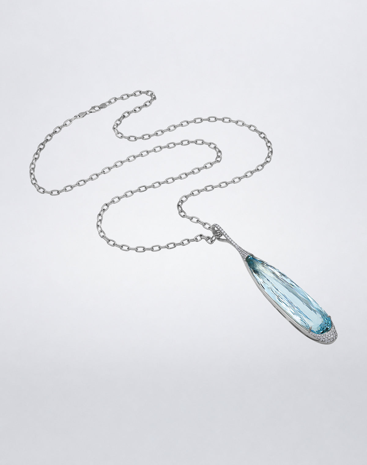 Full view of the Mindi Mond New York ICONS Aquamarine Diamond Pendant Link Necklace, featuring an elongated aquamarine pendant suspended from an 18K white gold link chain.
