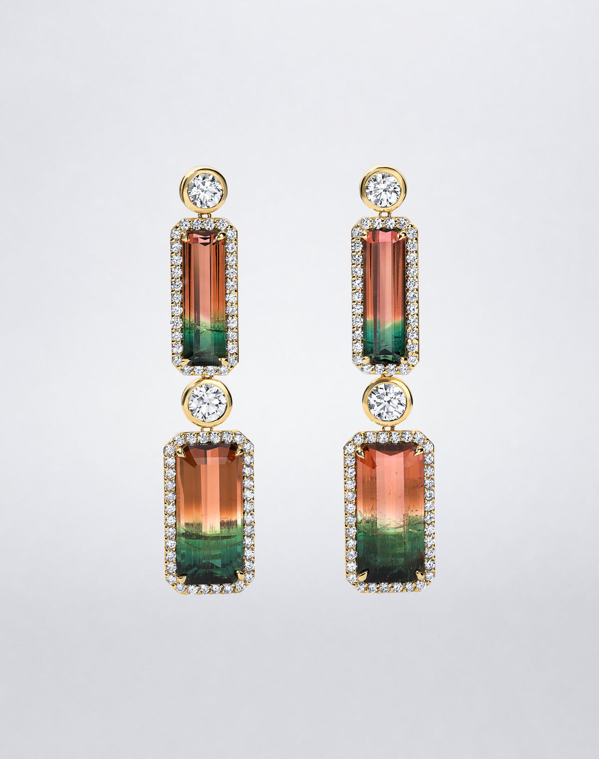 Pair of Mindi Mond New York Bi-Color Watermelon Tourmaline Earrings in 18K yellow gold, featuring rectangular bi-color tourmalines framed by diamonds and linked by round diamonds.