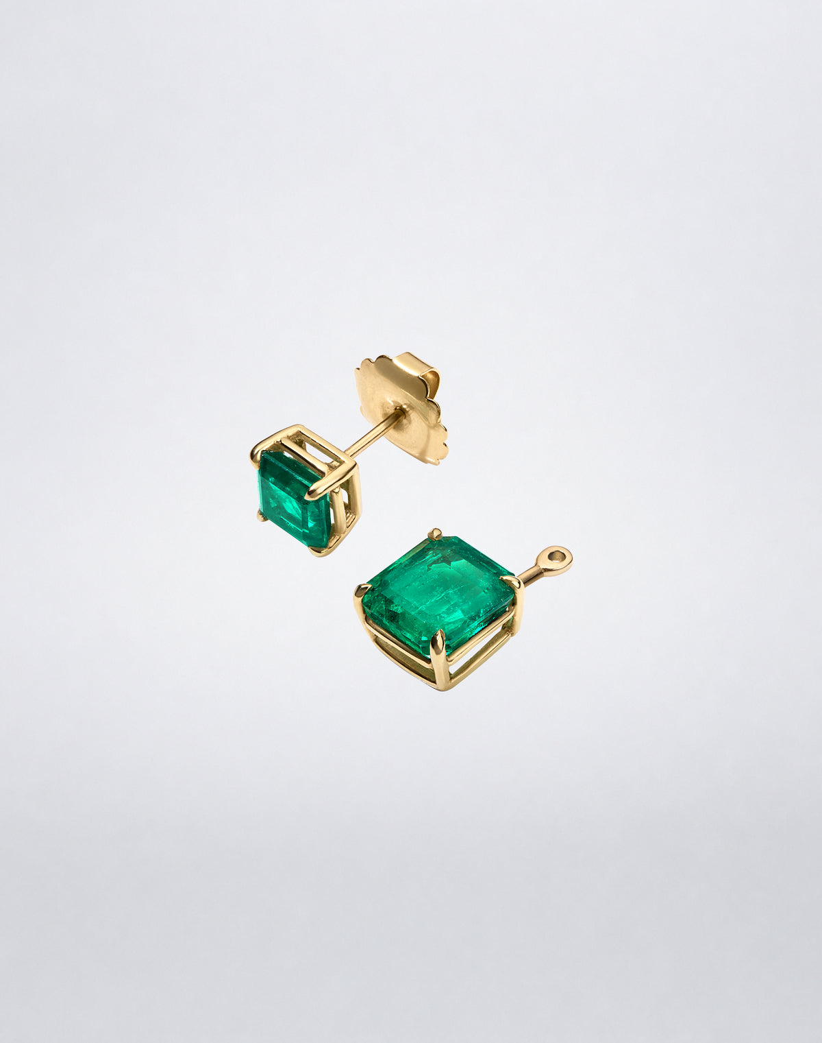 Mindi Mond New York ICONS Colombian Emerald Drop and Stud Earrings in 18K yellow gold, angled view showing the detachable emerald drops and stud earrings.