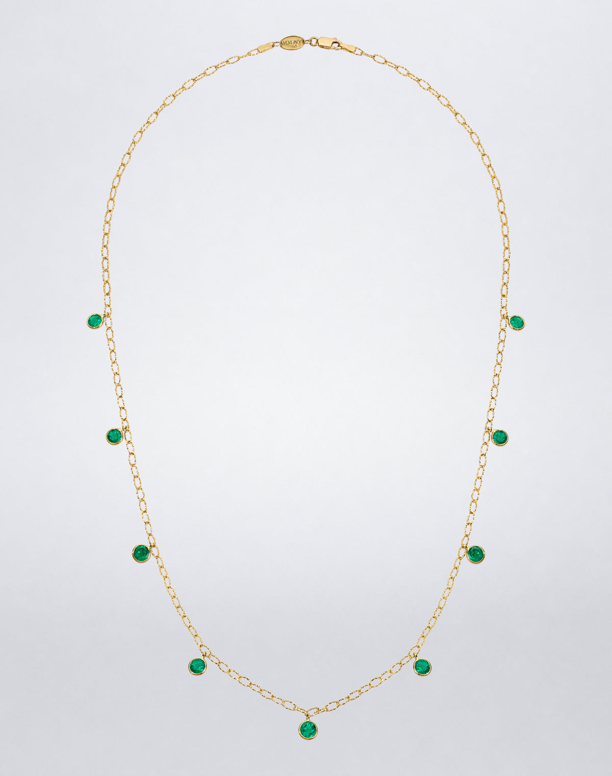 Mindi Mond New York ICONS Colombian Emerald Drop Tinsel Chain Necklace in 18K yellow gold, 20-inch front view with bezel-set emerald drops.