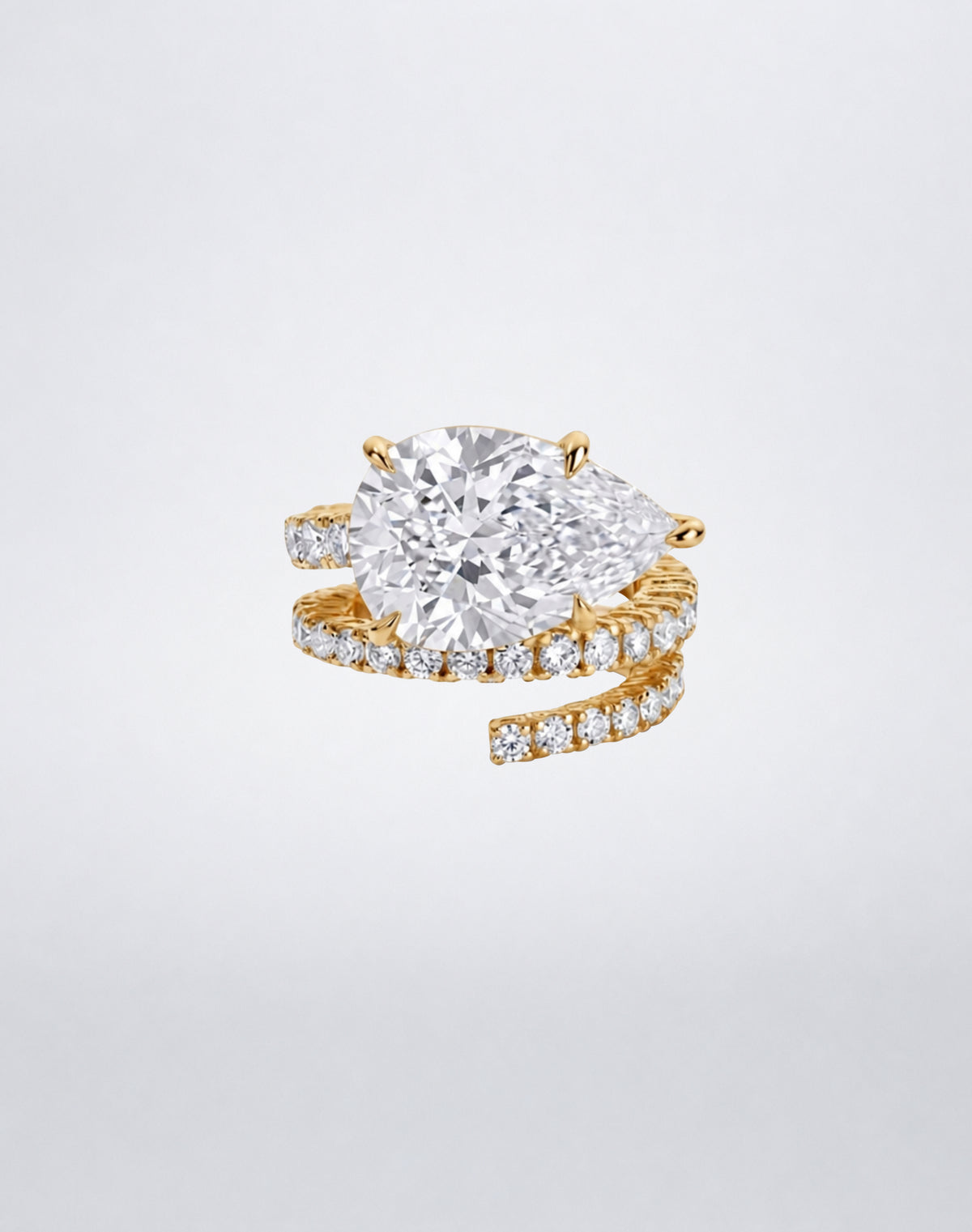 Mindi Mond New York Diamond Spiral Ring with pear-shaped diamond and pavé diamond spiral in 18K yellow gold.