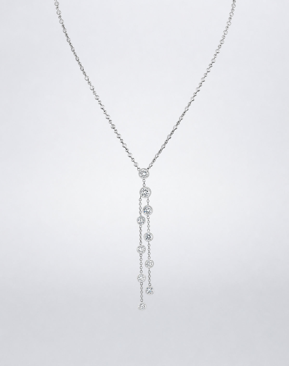 Mindi Mond New York ICONS Dripping Diamonds Necklace in 18K white gold, featuring bezel-set diamonds cascading along two delicate strands.