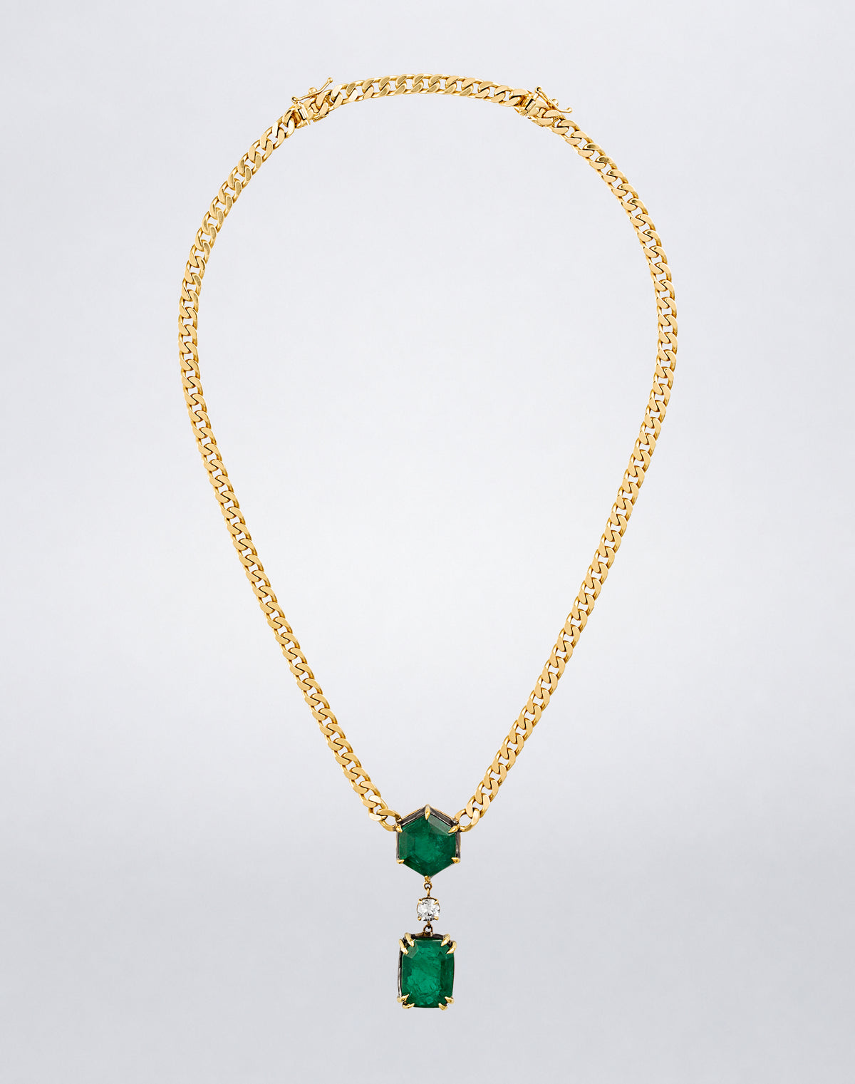 Mindi Mond New York ICONS Dynamic Duo Emerald Necklace with two geometric emeralds and a diamond accent on an 18K yellow gold curb chain.