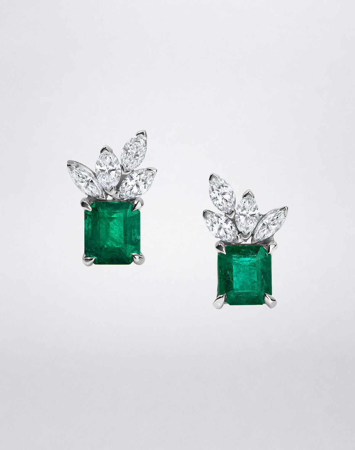 Mindi Mond New York ICONS Emerald Cluster Marquise Studs, staggered view showcasing emerald-cut emeralds and sculptural marquise-cut diamond clusters.