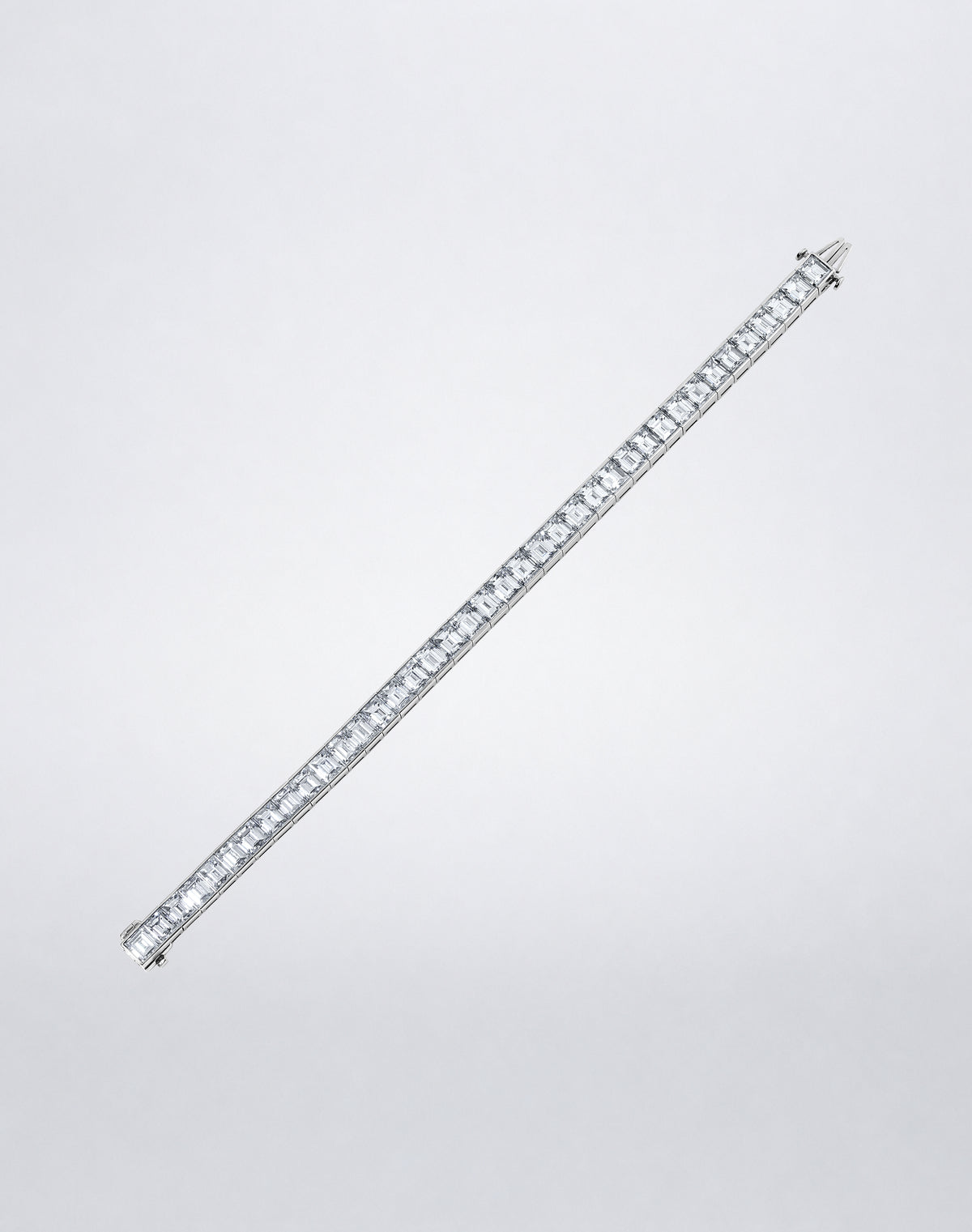 Mindi Mond New York ICONS Emerald Cut Diamond Line Bracelet in platinum, flat view featuring a continuous row of emerald-cut diamonds.