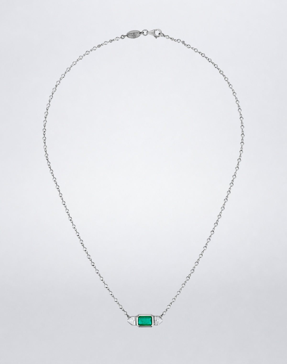 Mindi Mond New York Emerald and Diamond Trapezoid Necklace with an emerald-cut emerald, trapezoid and baguette diamonds in 18K white gold.