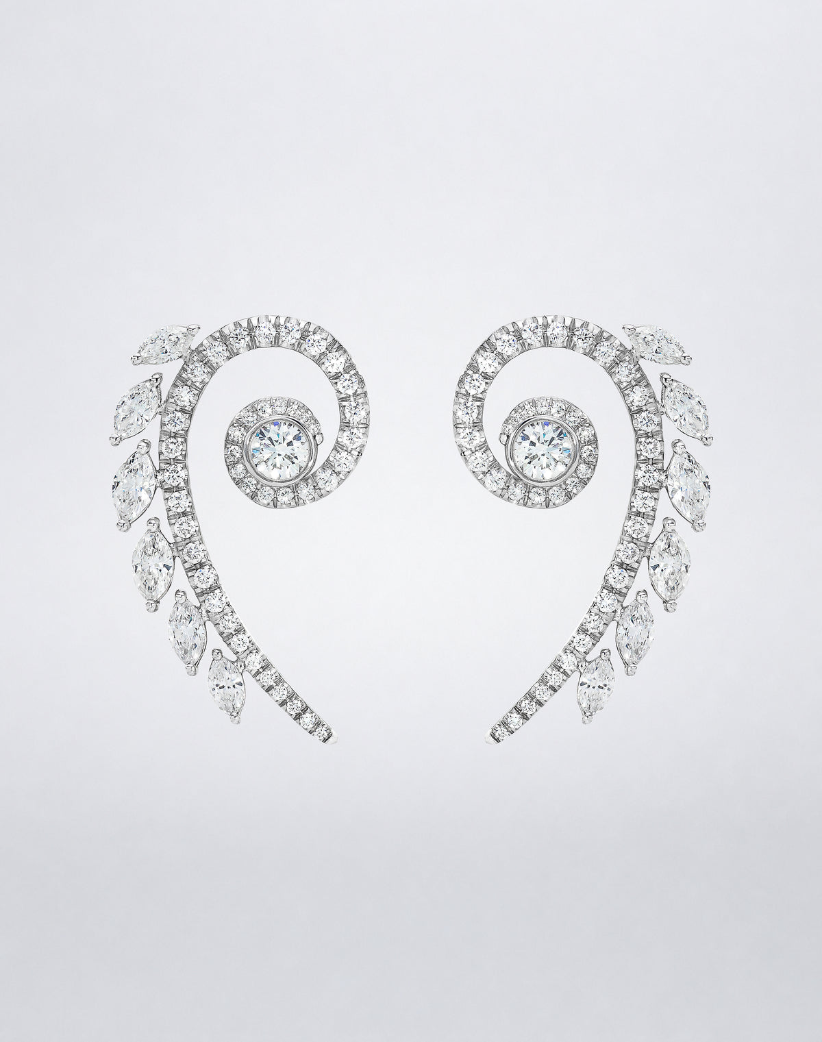 Mindi Mond New York ICONS Fibonacci Earrings in 18K white gold, detail view featuring spiraling round diamonds accented with marquise-cut diamonds.