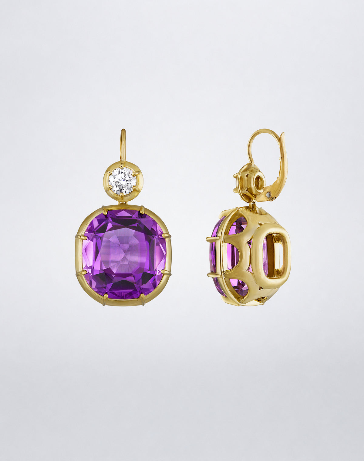 Mindi Mond New York ICONS Imperial Amethyst Diamond Drop Earrings in 18K yellow gold, detail view showing a cushion-cut amethyst and round diamond setting.