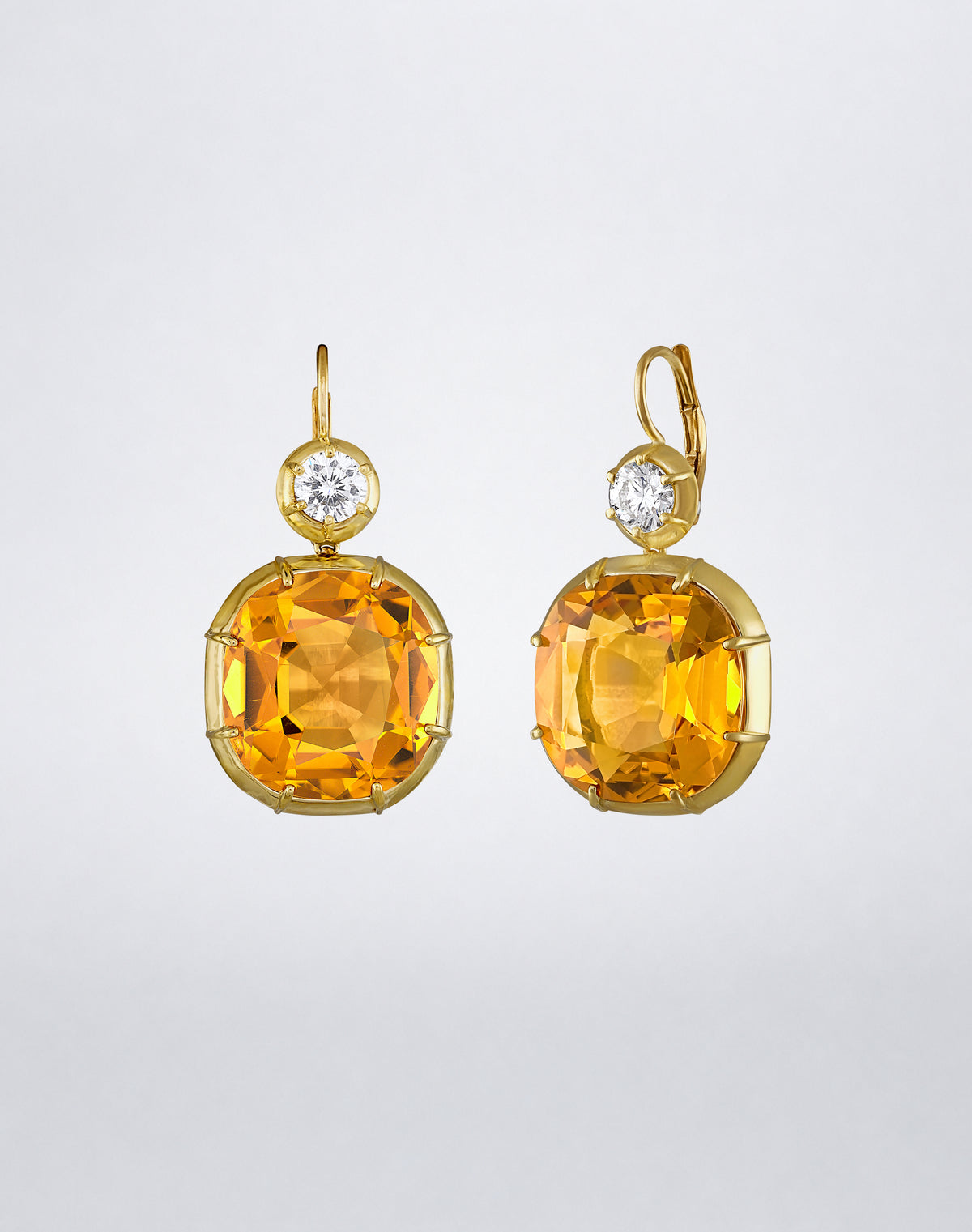 Side view of the Mindi Mond New York ICONS Imperial Citrine Diamond Drop Earrings in 18K yellow gold, highlighting the cushion-cut citrine setting and leverback closure.