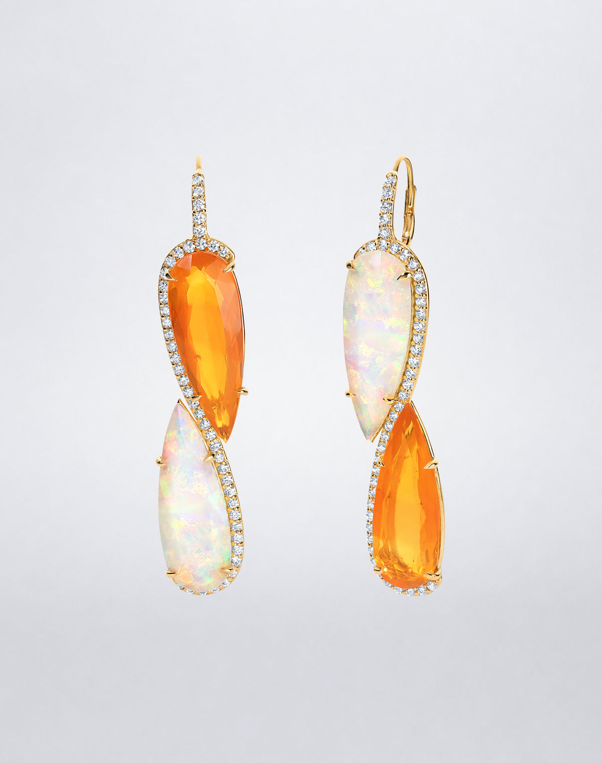 Side view of Mindi Mond New York ICONS Infinity Opal Earrings in 18K yellow gold, highlighting the interlocking opals, diamond setting and leverback closure.