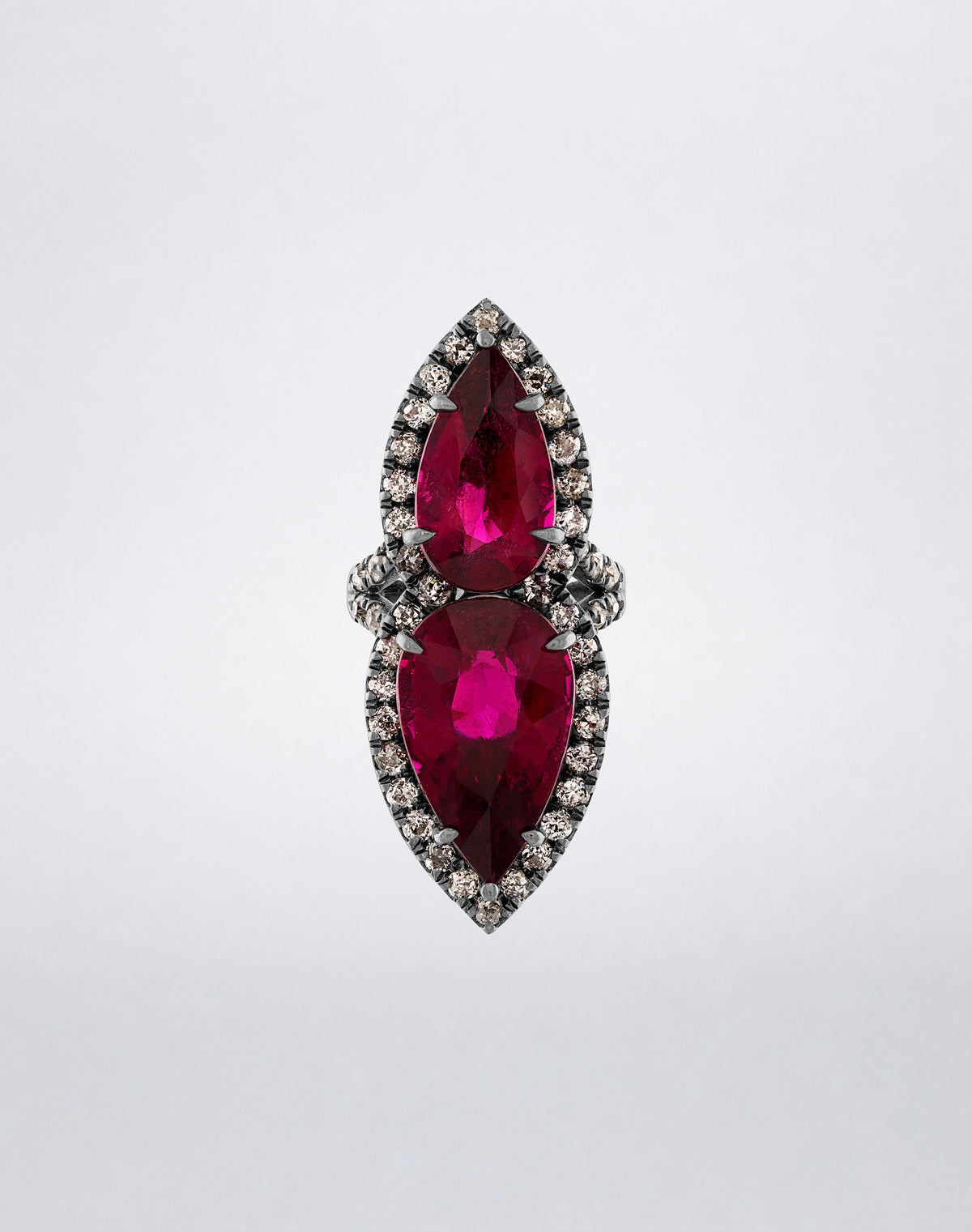 Mindi Mond New York Kissing Rubellite Ring with two pear-shaped rubellites surrounded by diamond halos in 18K blackened gold, front view.