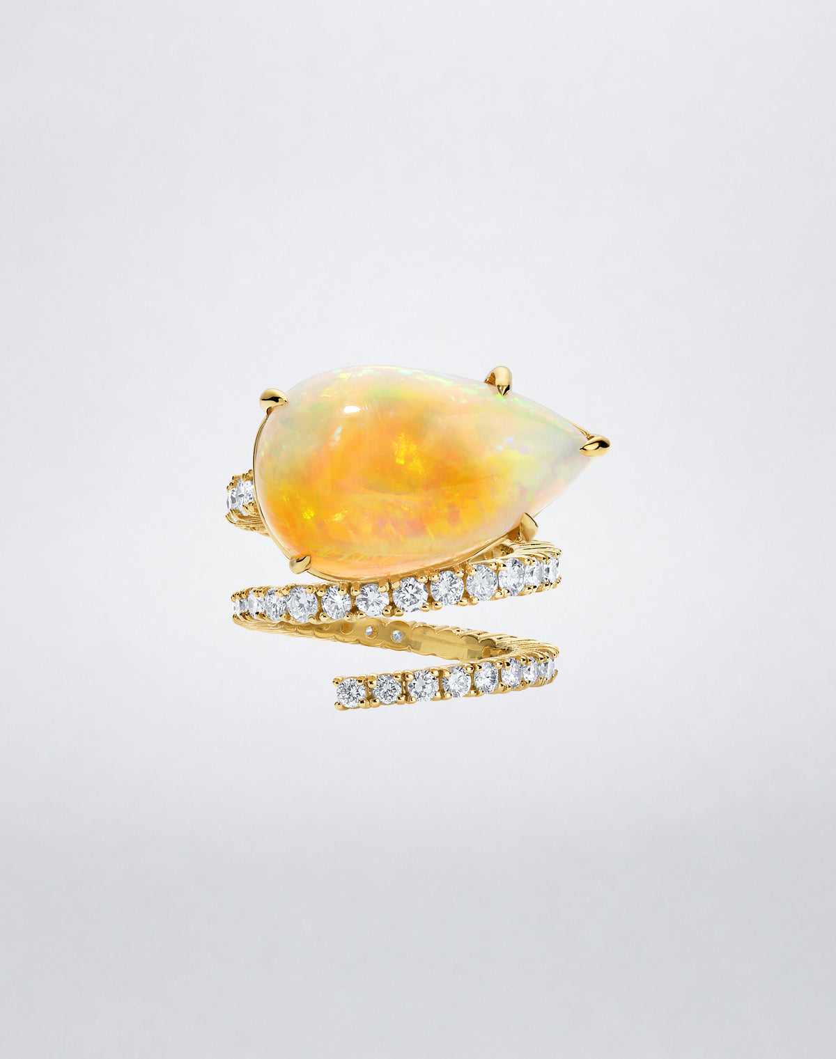 Mindi Mond New York Opal and Diamond Double Spiral Ring with a luminous opal and pavé diamond double spiral in 18K yellow gold.