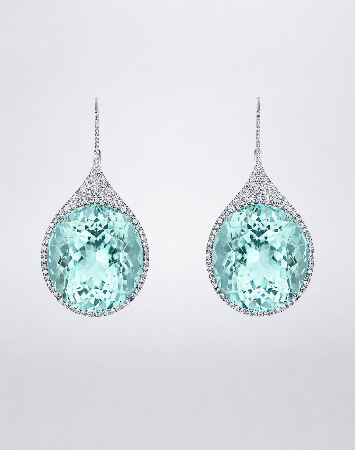 Mindi Mond New York ICONS Paraiba Tourmaline Earrings in 18K white gold, front view featuring oval-cut Paraiba tourmalines framed by pavé diamonds.