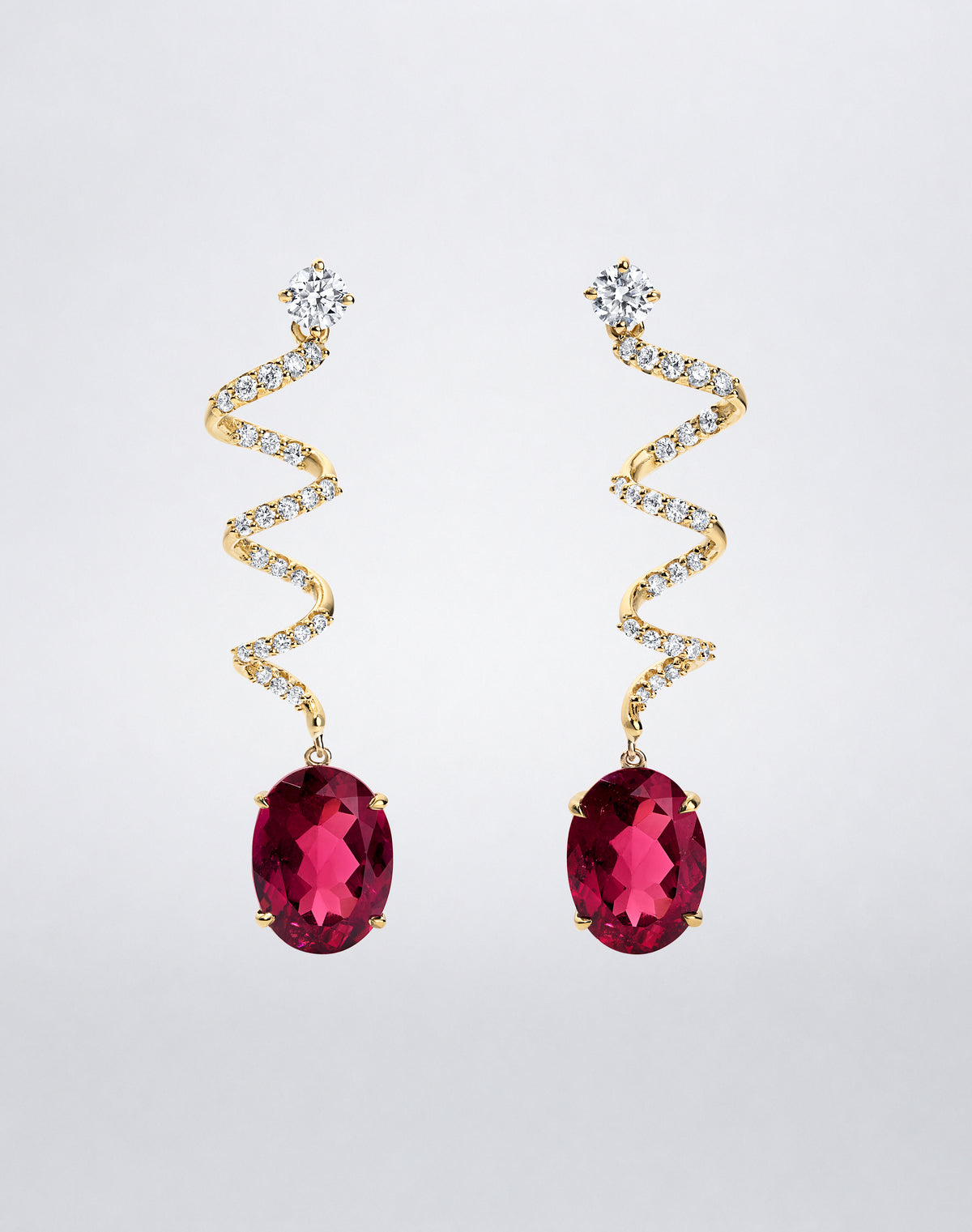 Mindi Mond New York ICONS Rubellite Diamond Spiral Earrings in 18K yellow gold, front view featuring oval rubellites suspended from pavé diamond spirals.