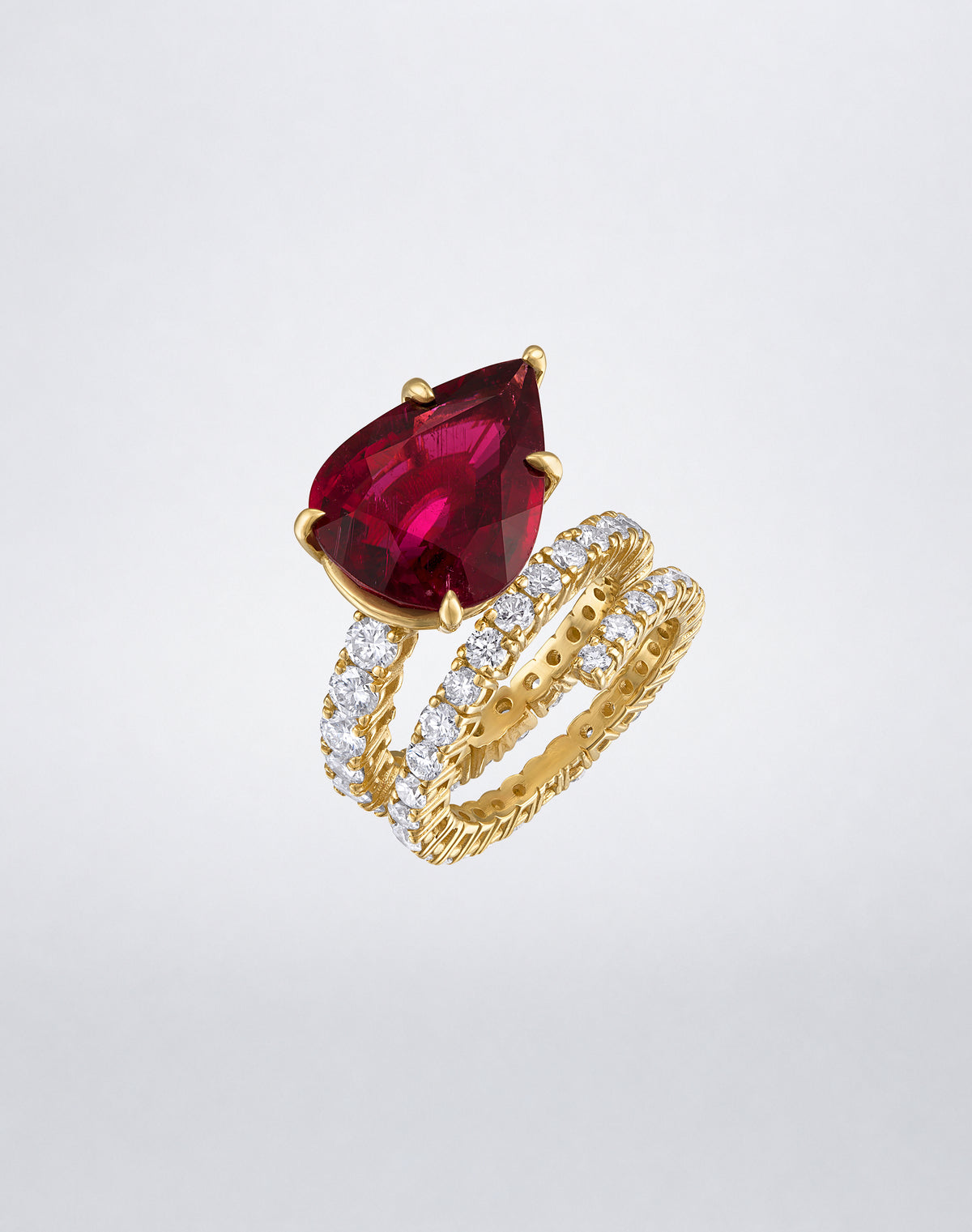 Mindi Mond New York Rubellite and Diamond Double Spiral Ring in 18K yellow gold, angled view showing the rubellite and diamond spiral design.