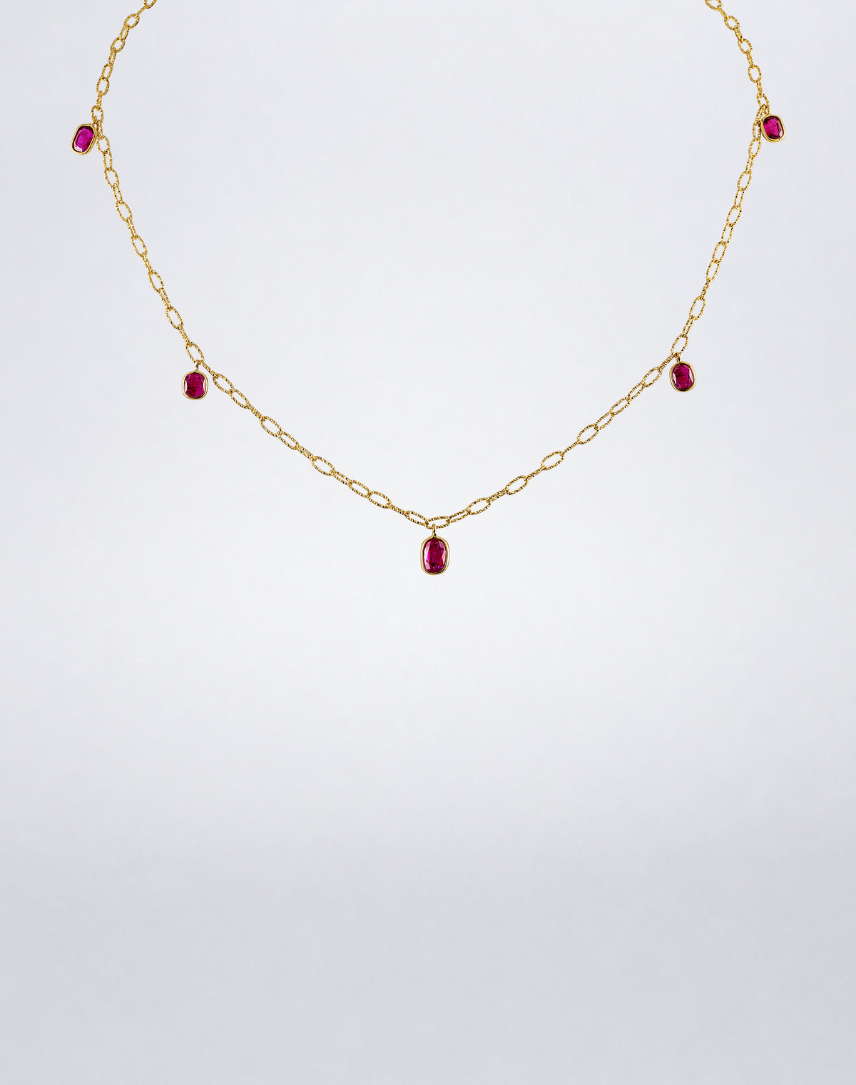16-inch Mindi Mond New York Ruby 5 Drop Tinsel Chain Necklace in 18K yellow gold with five bezel-set ruby drops.