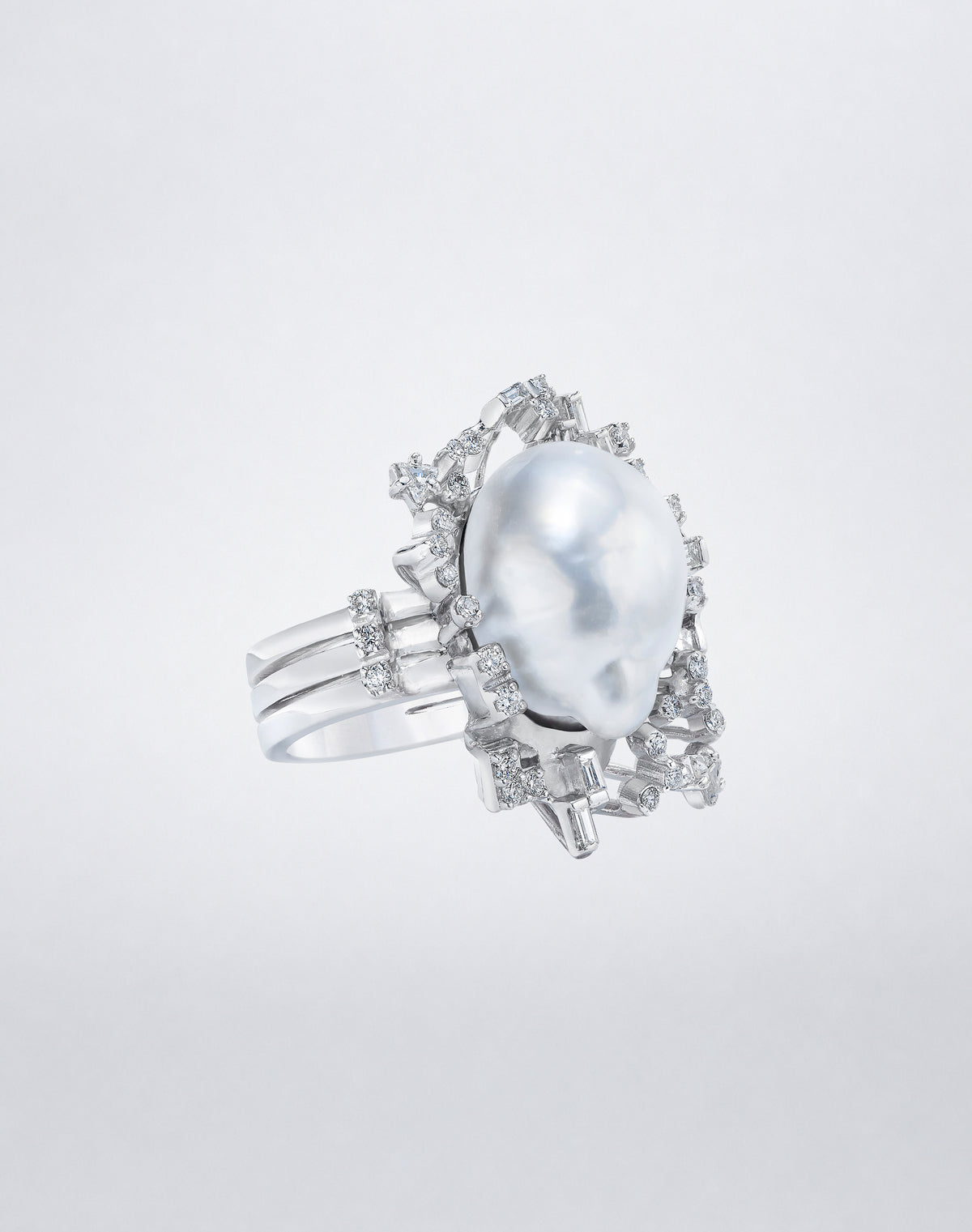 Mindi Mond New York South Sea Baroque Pearl Diamond Ring with a baroque pearl and sculptural mixed-cut diamond setting in 18K white gold, angled view.