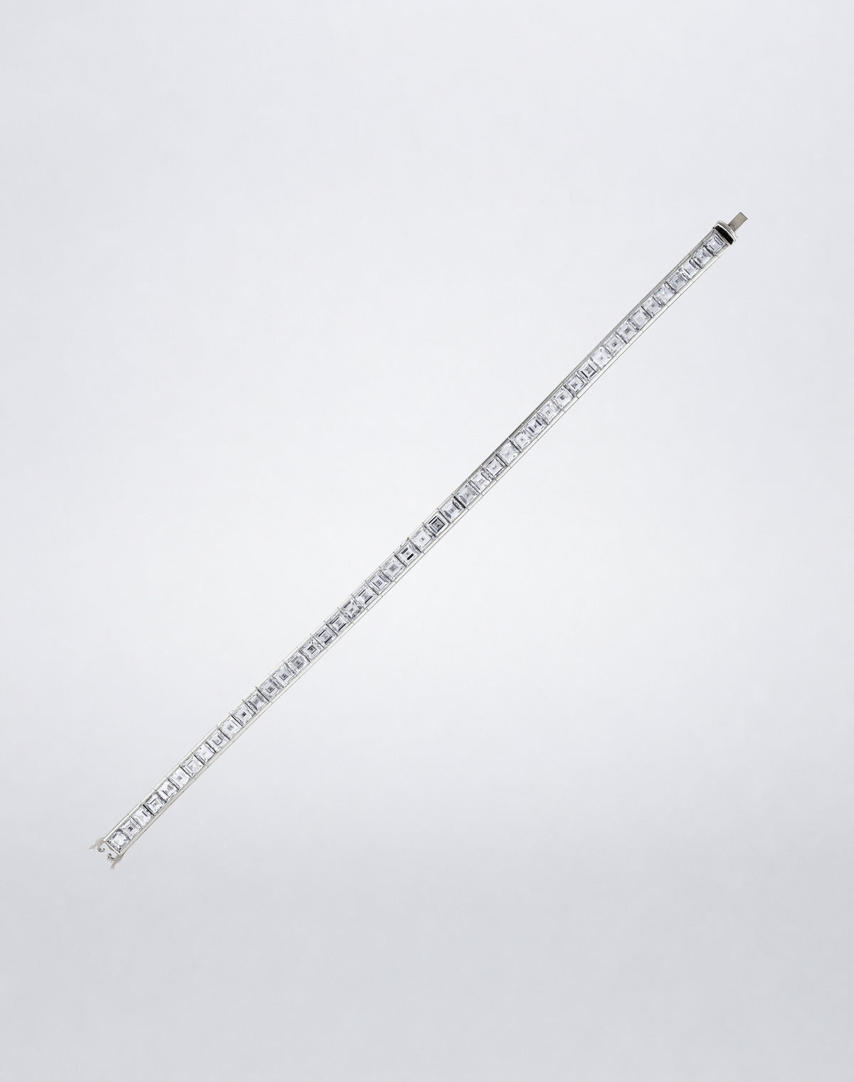 Mindi Mond New York ICONS Square Emerald-Cut Diamond Line Bracelet in platinum, flat view featuring a continuous row of square emerald-cut diamonds.