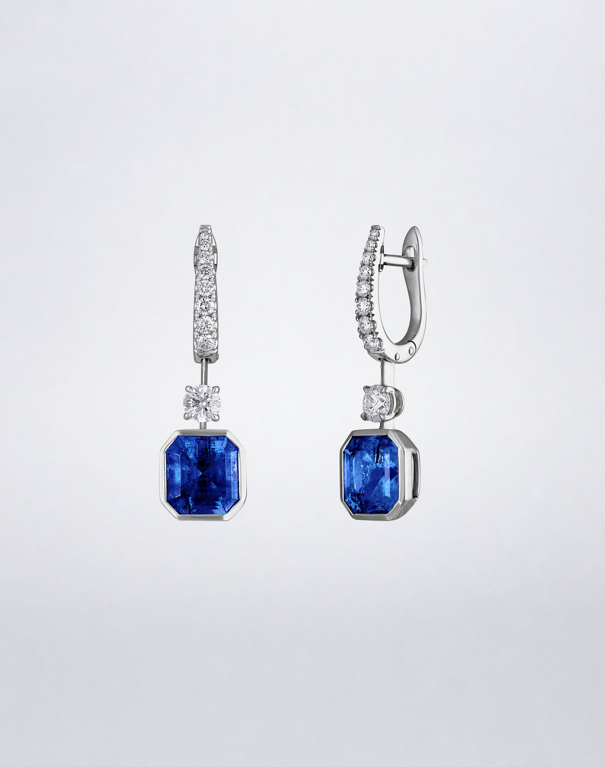 Side view of Mindi Mond New York ICONS Suspended Gemstone and Diamond Earrings in 18K white gold, highlighting the sapphire drops, diamond connectors and pavé setting.