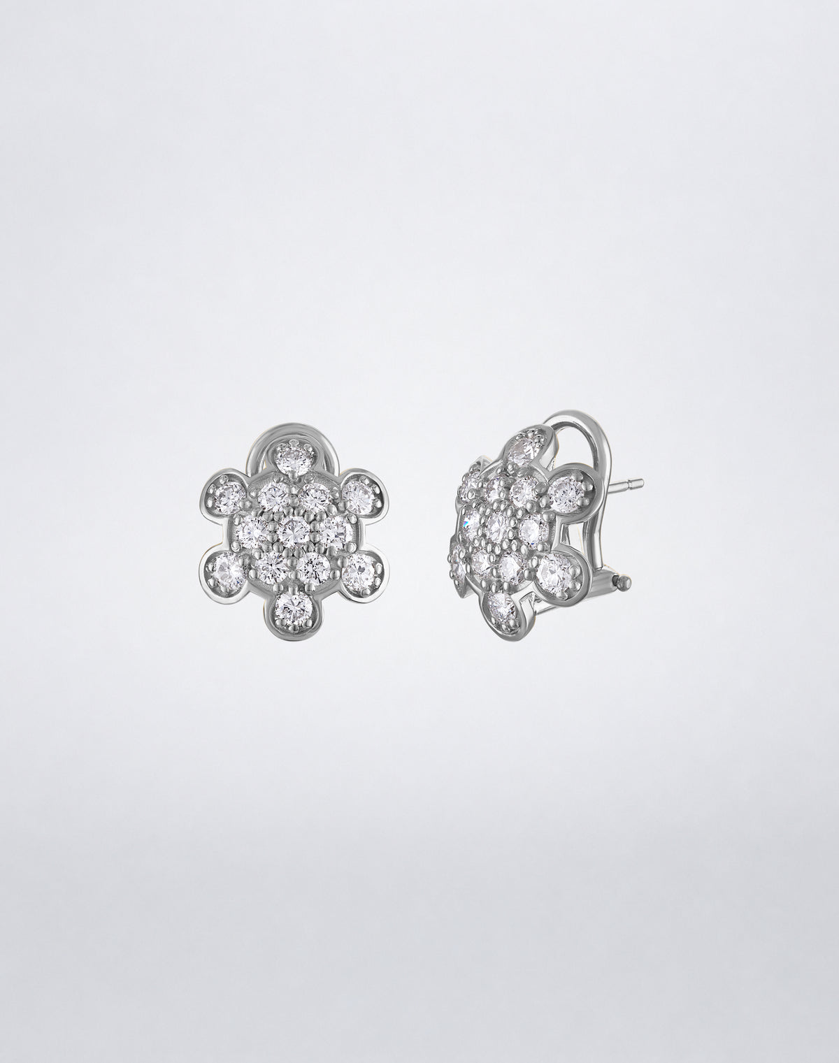 Side view of Mindi Mond New York ICONS Turtle Back Pavé Stud Earrings in 18K white gold, highlighting the dimensional setting and post closure.