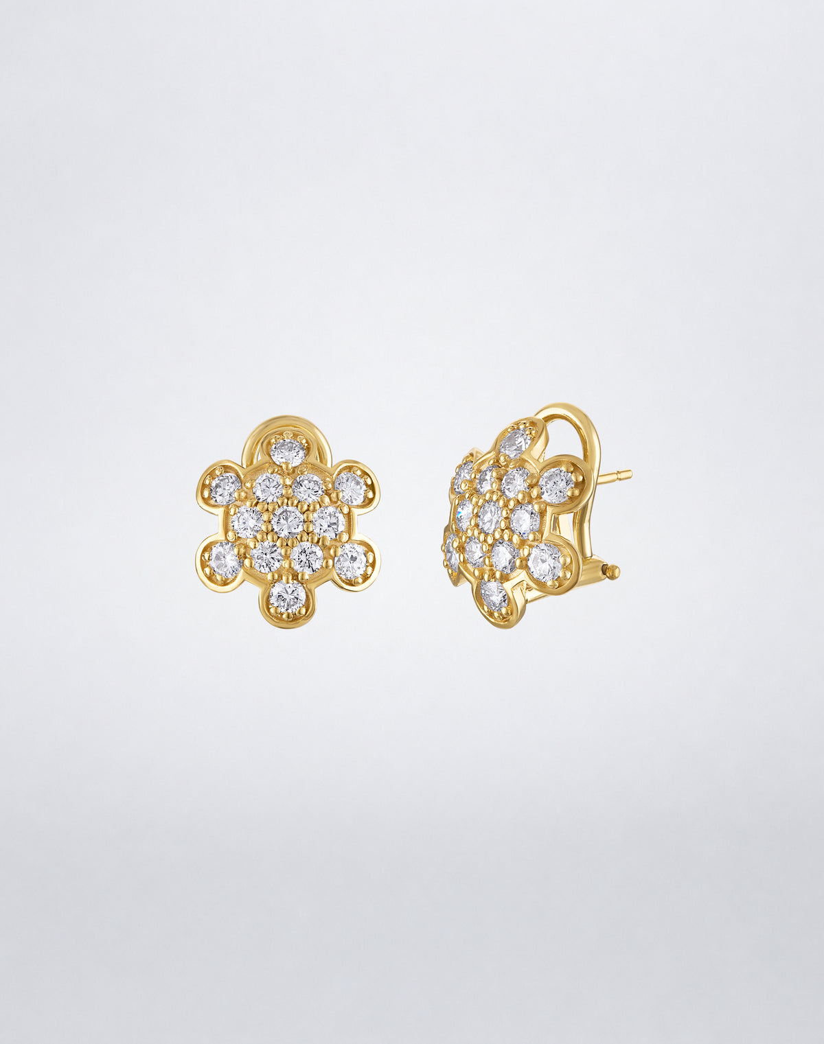 Side view of Mindi Mond New York ICONS Turtle Back Pavé Stud Earrings in 18K yellow gold, highlighting the dimensional setting and post closure.