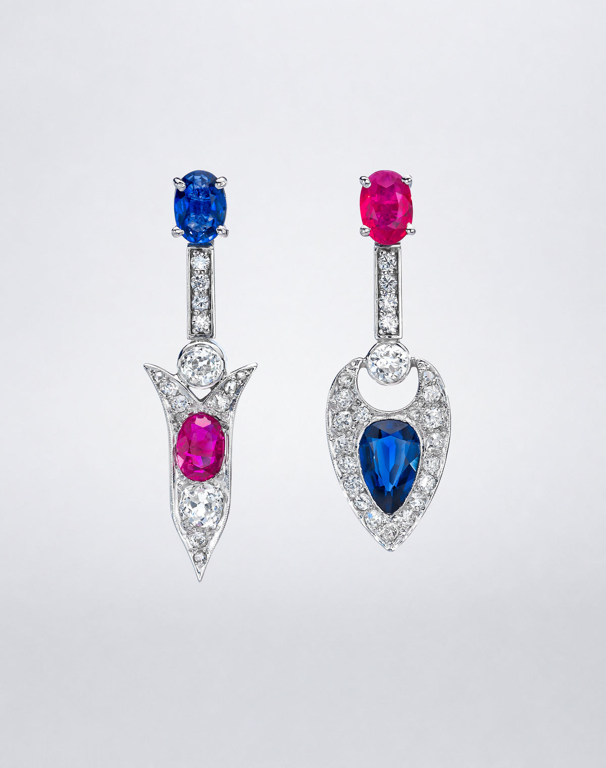 One-of-a-kind Broken Arrow Pendant Earrings with rubies, blue sapphires and diamonds set in platinum in a mismatched geometric drop design.
