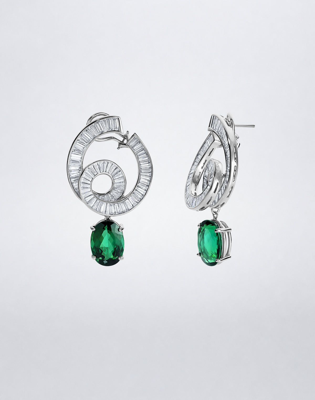 Side view of the one-of-a-kind Celestial Diamond and Green Tourmaline Earrings showing the sculptural diamond setting and detachable tourmaline drops.