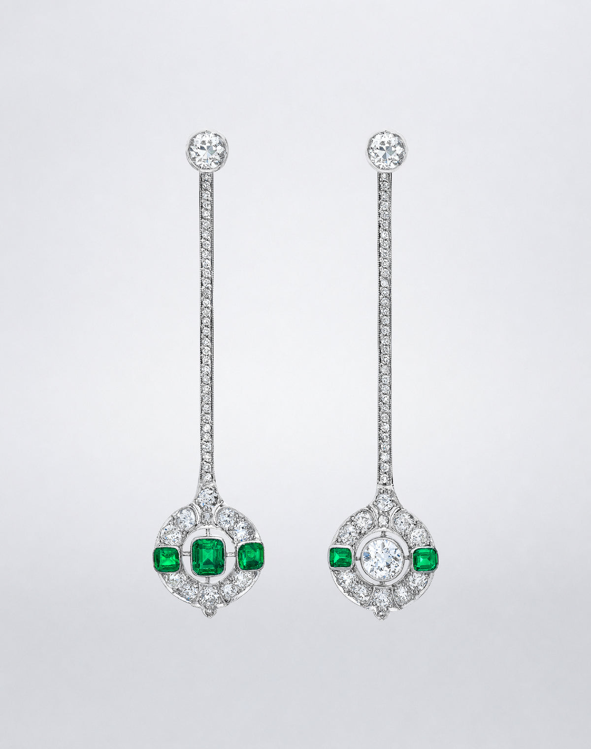 One-of-a-kind Emerald and Diamond Asymmetric Earrings featuring long diamond-set bars and mismatched emerald and diamond drops in platinum.