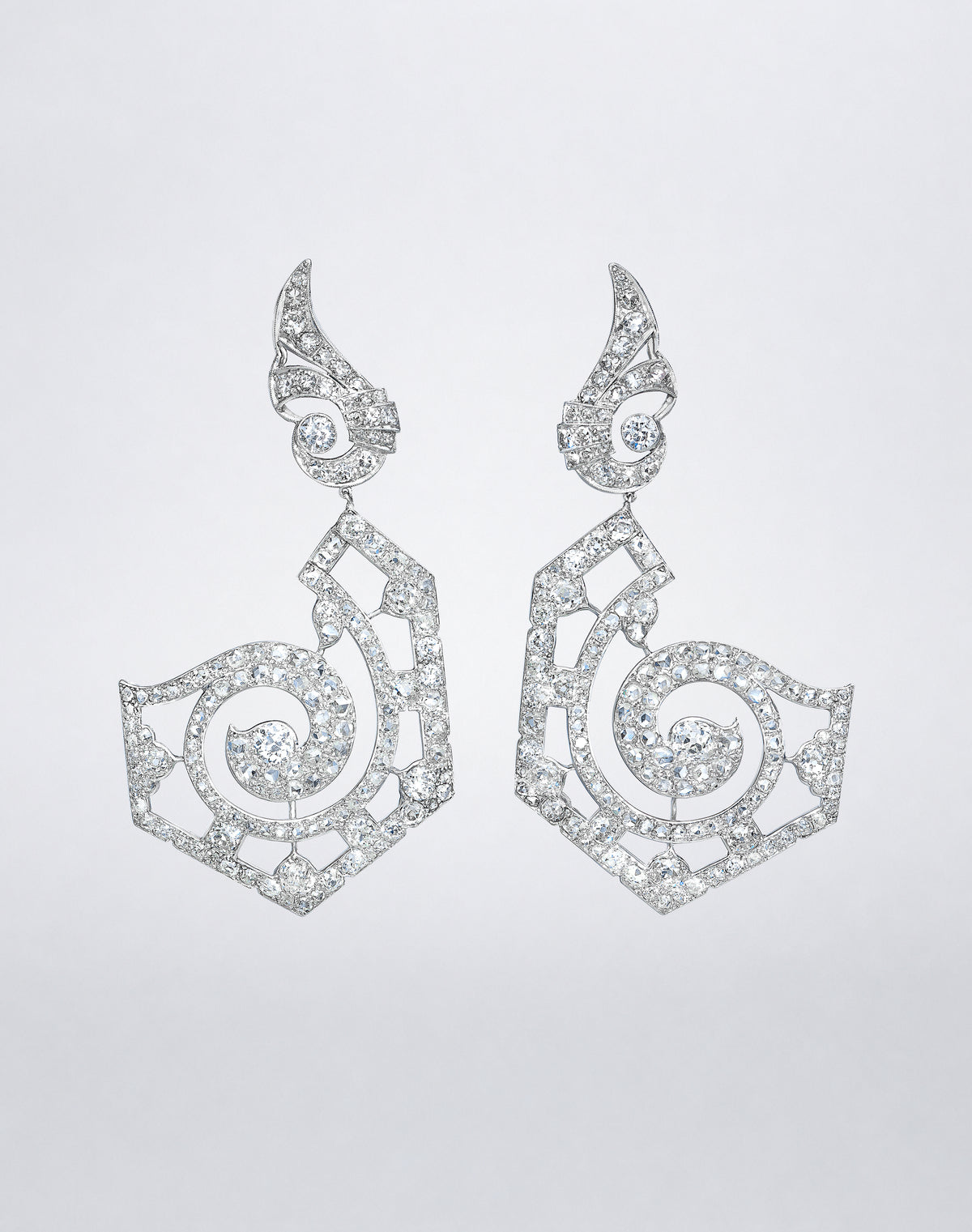 One-of-a-kind Mega Galaxy Earrings featuring dramatic sculptural openwork drops with swirling diamond-set motifs and mixed-cut diamond accents.